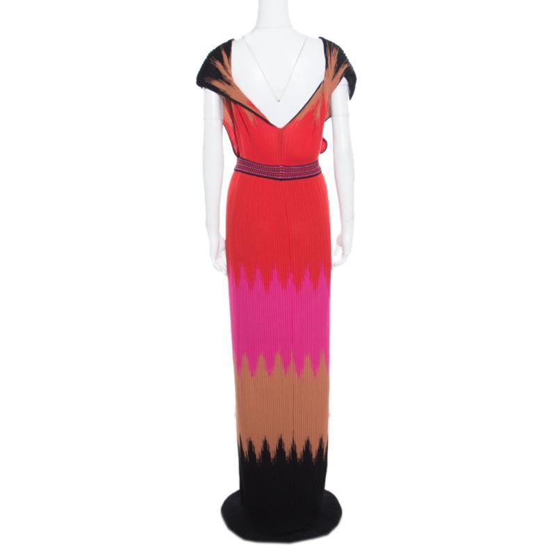 Get your hands on this maxi dress from the house of M Missoni. Celebrated for its knitwear, M Missoni's dress features a multicolor knit pattern and finished with a pleated pattern. This floor-length dress comes with a plunging neckline. We love the