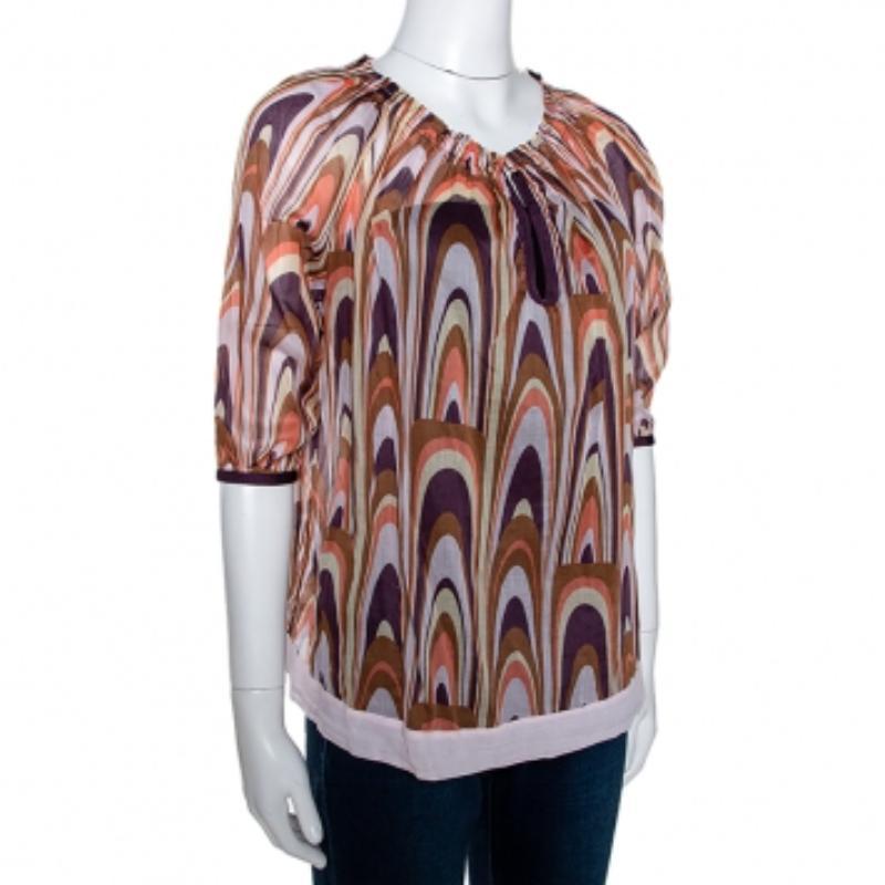 You must get your hands on this lovely creation from M Missoni. The top is made from quality cotton and it has short sleeves, a ruched neckline and all over, there are colourful patterns. It is perfect for long casual days.
