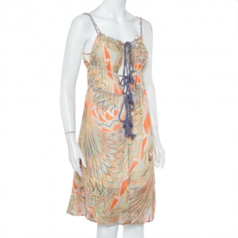 Look fabulous in this chic printed multicolored outfit as you go out and about town. Elegant and stylish, this chiffon dress is a classic in any fashionista's collection. It is lightweight, sleeveless, and has a self-tie detail in the front.