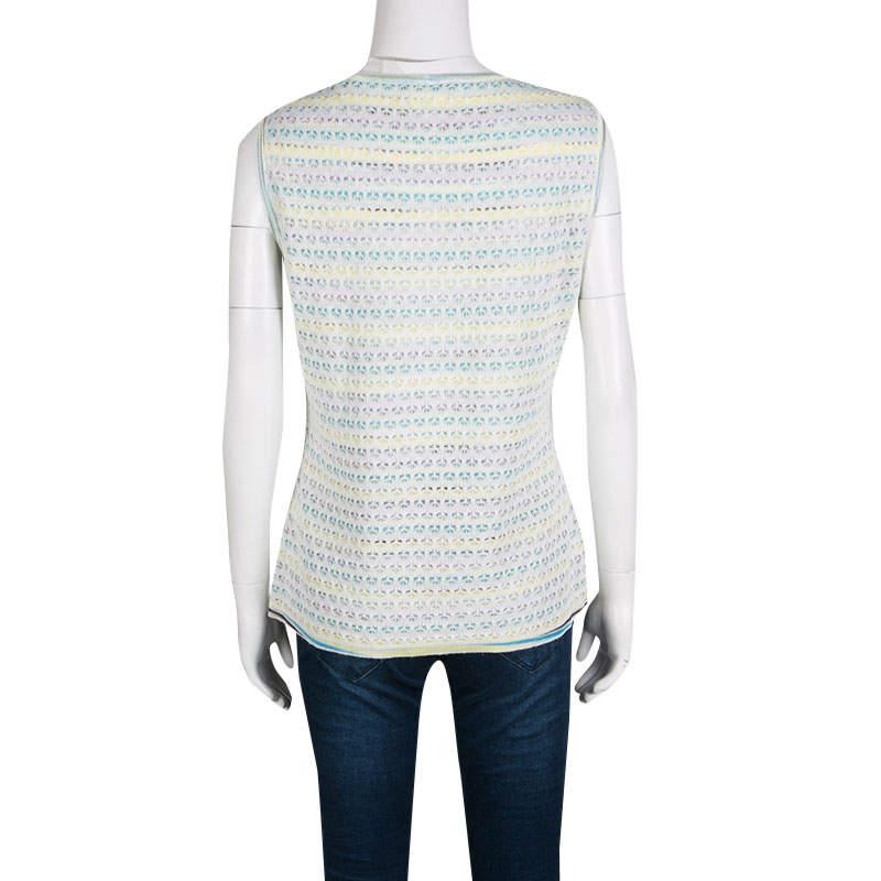Sometimes simple is more stylish, and this top from M Missoni proves this to be just right. This one is designed in a plain, straight structure featuring a multicolored striped pattern. It is detailed with floral crochet knitting and is complete