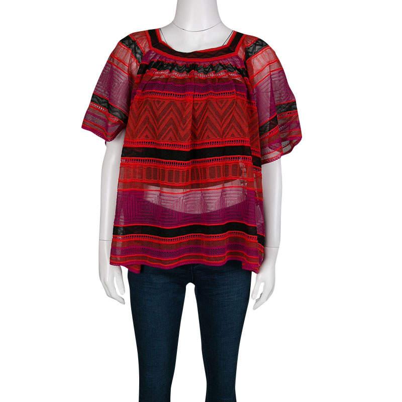 Designed in a relaxed silhouette featuring feminine multicolored hues, this M Missoni top is ideal for people who love to a flaunt an easy, straightforward style. Knitted in perforated form, the top underlines a striped design with geometric