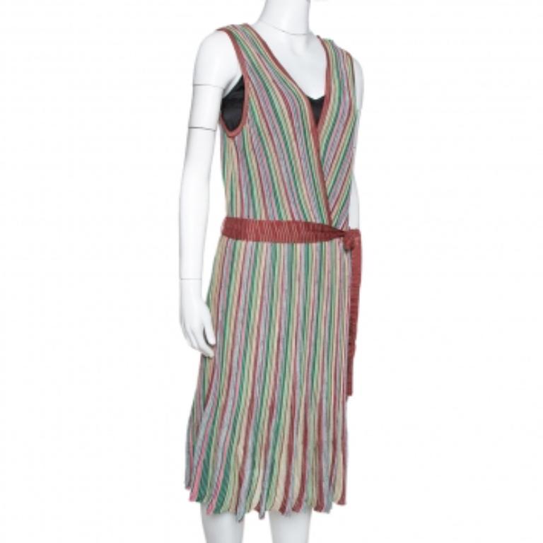 Feminity and effortless style are two attributes that prominently standouts in this M Missoni dress. This striped outfit is cut to a pretty silhouette with a wrap-like bodice and a V neckline. We like how the fluid structure of the dress is balanced
