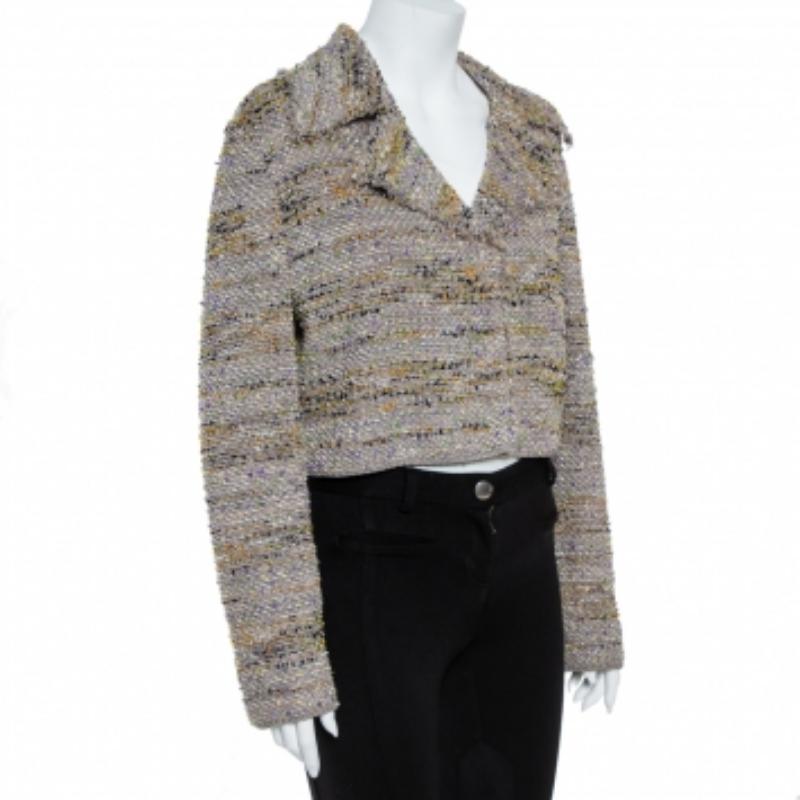 This stylish blazer comes from the house of M Missoni. It has been crafted from multicolored tweed and has been styled with a cropped silhouette. It has long sleeves, a collar, a buttoned front and an exterior that will complement all your evening