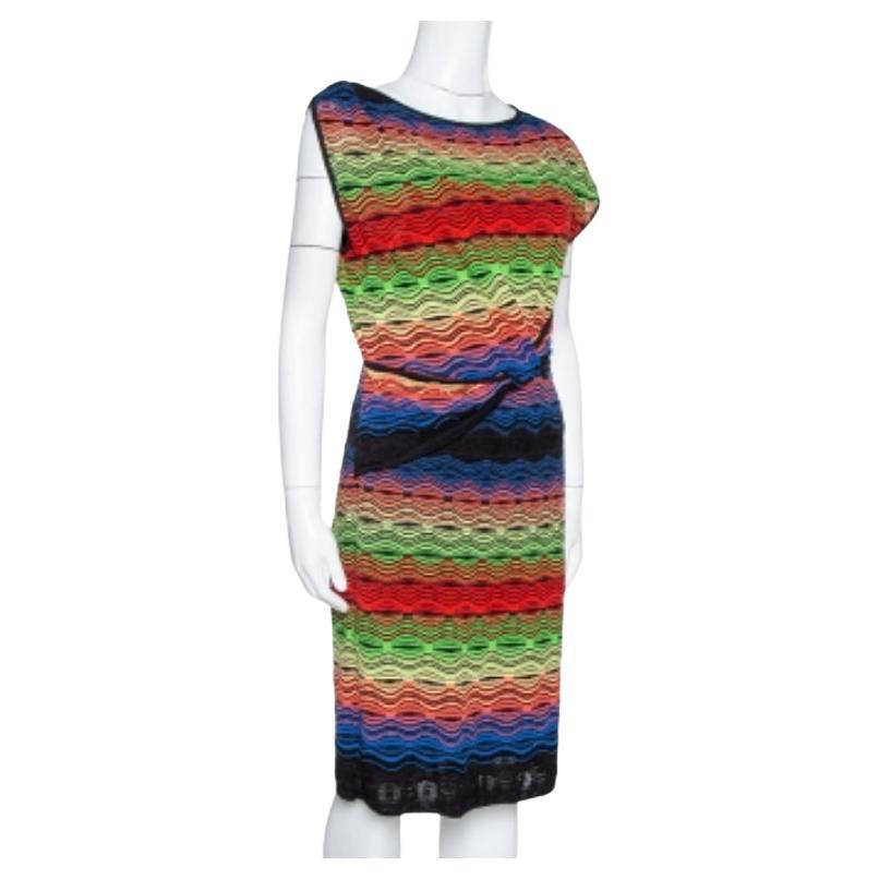 M Missoni's dress is a chic option for your casual or evening meets. Designed in multicolors, the dress has a knit fabric body, a sleeveless style, and a wavy pattern all over. Team this with complementing wedge heels to complete the look.