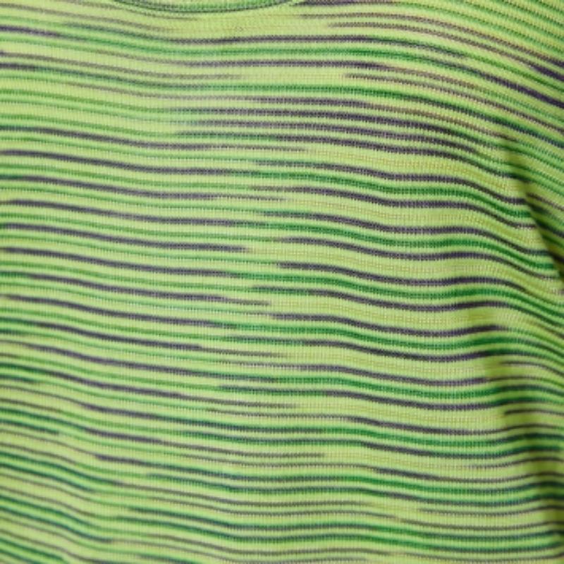 This tank top from M Missoni is here to make you look fashionable. It is tailored using neon-green striped knit silk fabric and displays a sleeveless style and a rounded neckline. Wear it with black leggings and flats for casual outings.