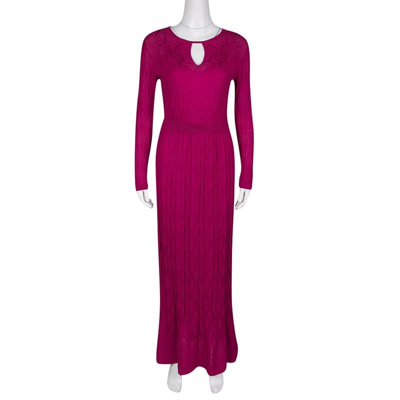 An elegant dress that offers you both comfort and style, this M Missoni creation is fabulously crafted to a fitted silhouette with an impressive maxi length. It has long sleeves and features a cutout detail on the round neckline. The gathered