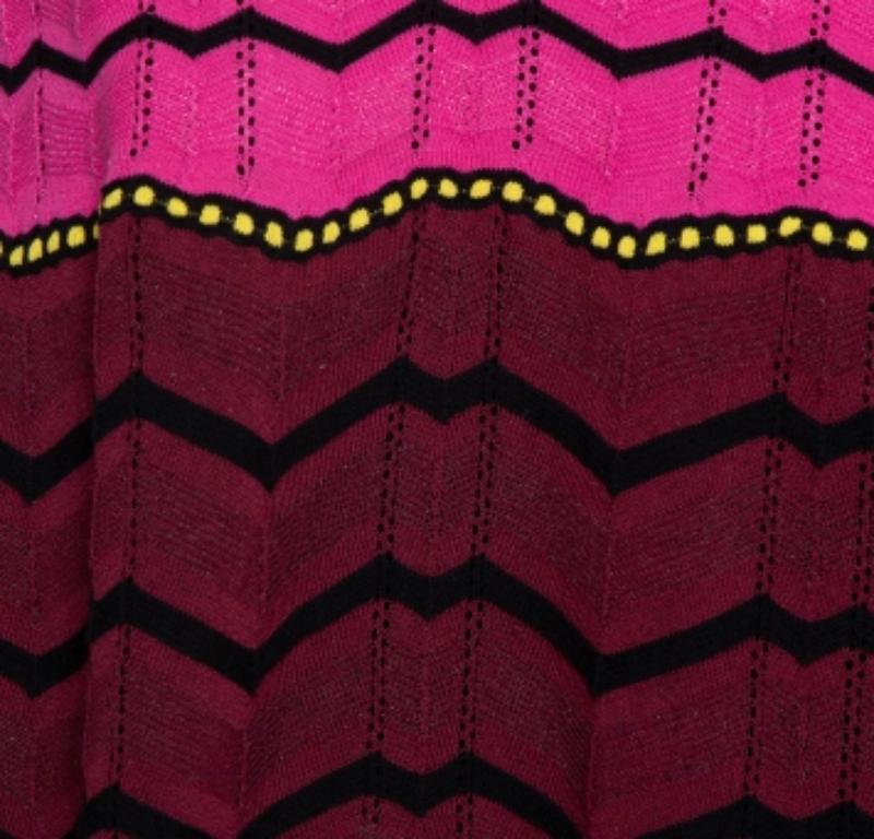 This top from M Missoni is well-crafted and absolutely gorgeous. Flaunting pretty shades of pink, this top features a beautiful neckline, a flared silhouette, and a zig-zag pattern all over. Knit to perfection, this piece is wonderful enough to help