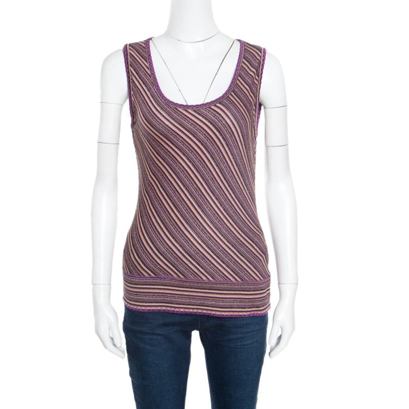 M Missoni gives you this top and cardigan set to complement your casual attire. Cut from a blend of fabrics, the set is designed in an identical pattern with a smartly shaped sleeveless top and a full sleeves buttoned cardigan. The purple striped