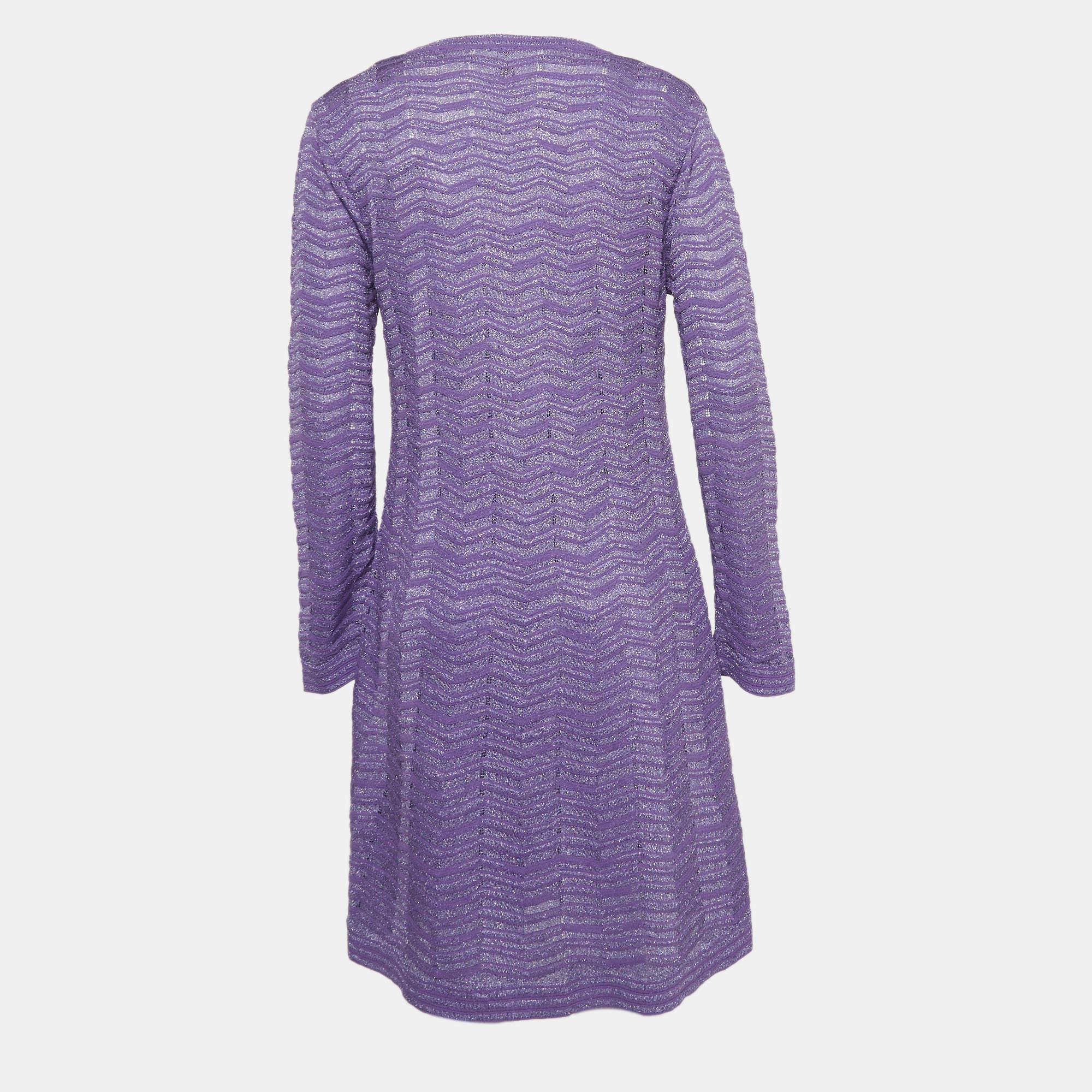 Step into timeless elegance with this M Missoni dress. Meticulously crafted, it embodies grace and sophistication, making it the perfect choice for those seeking an exquisite wardrobe addition.

