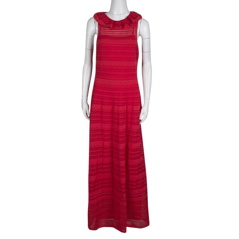 This gorgeous red dress from M Missoni is designed to elevate your look during casual events. The cotton blend maxi dress has a sleeveless design, scallop detailing, and a ruffled neckline. Team it with a pair of metallic flats or heels for a