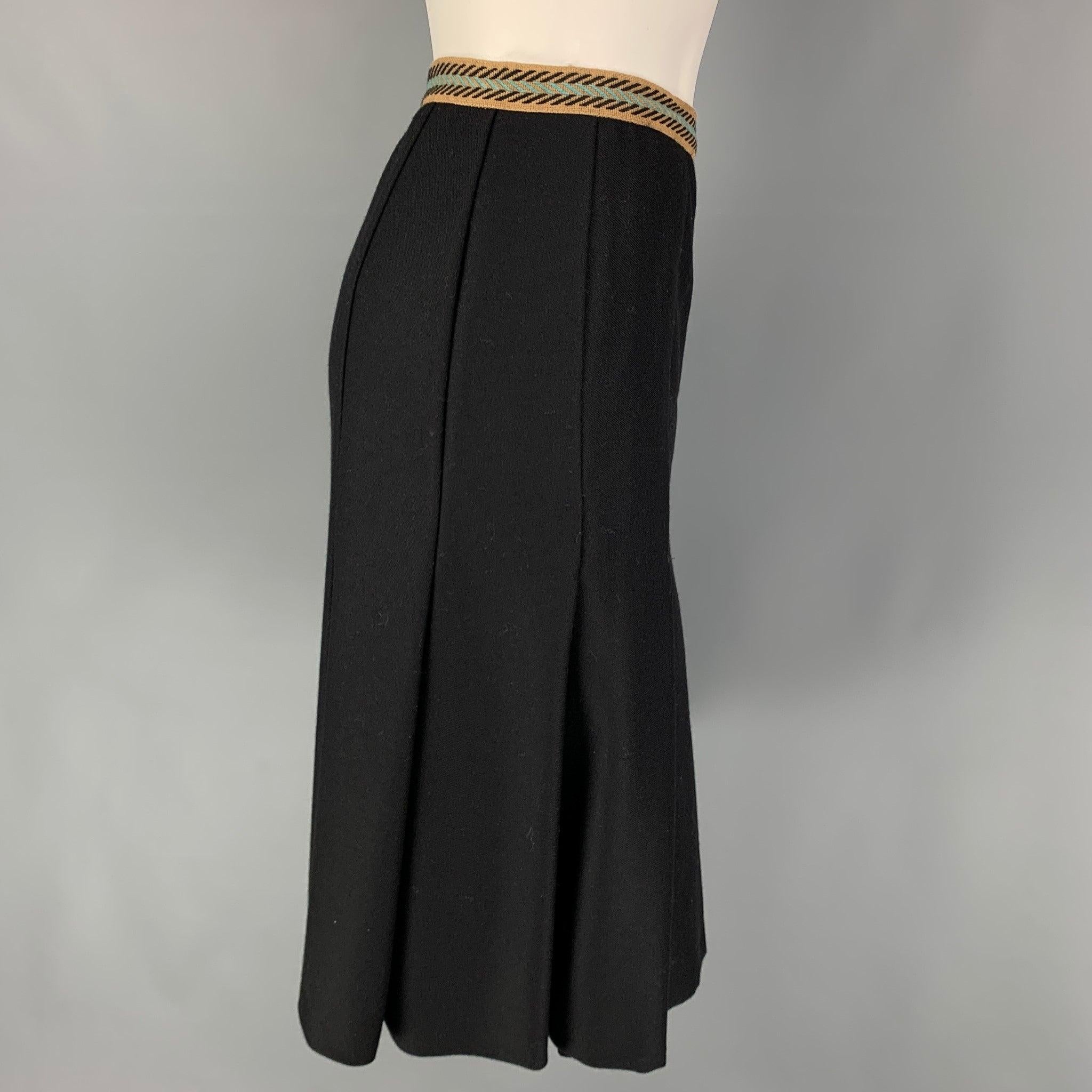 M MISSONI skirt comes in a black wool with a pleated style, printed tan waist, and a side zipper closure. Made in Italy. Very Good
Pre-Owned Condition. 

Marked:   I 46 / D 40 / E 42 / GB 14 / USA 10 

Measurements: 
  Waist: 32 inches Hip: 38