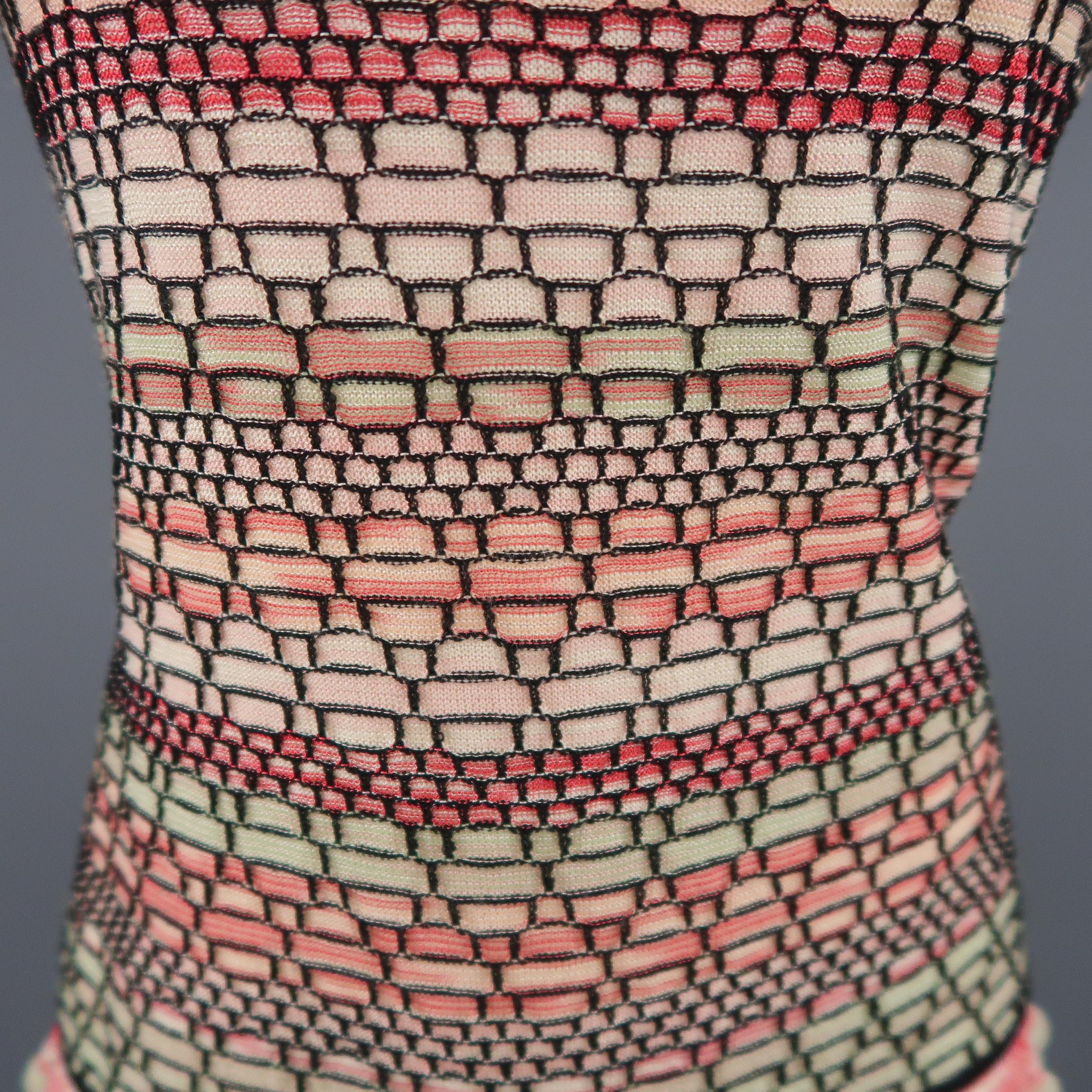 M MISSONI tank top comes in a textured knit with hues of pink and green with an all over black patter, scoop neck, and black piping, and ruffled hem. Matching cardigan available separately. Made in Italy.
 
Excellent Pre-Owned Condition.
Marked: 14
