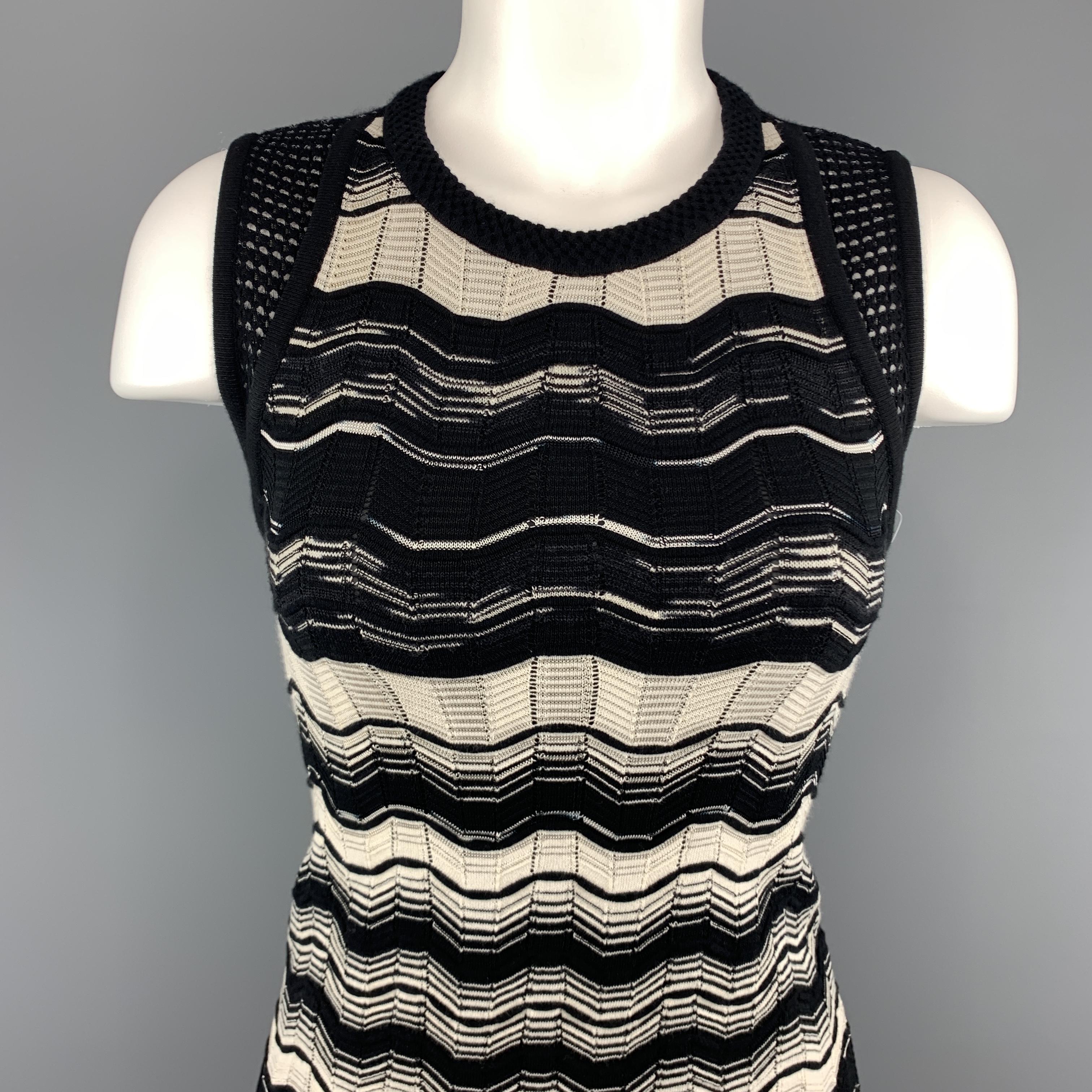 M MISSONI dress comes in a beige and black textured stripe knit with a round neckline, and mesh knit shoulder panels.
 
Excellent Pre-Owned Condition.
Marked: 2
 
Measurements:
 
Shoulder: 12 in.
Bust: 34 in.
Waist: 24 in.
Hip: 34 in.
Length: 37 in.