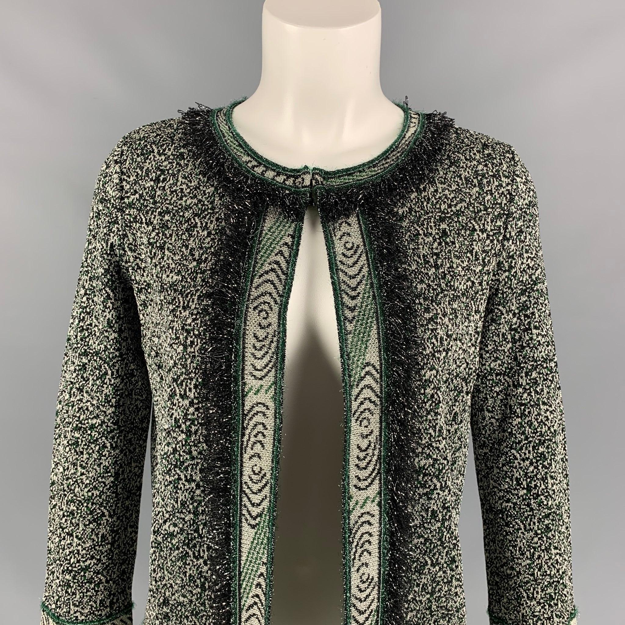 M MISSONI cardigan comes in a green & silver knitted acetate blend featuring a fringe trim, hook & loop detail, and a open front. Made in Italy.
Very Good
Pre-Owned Condition. 

Marked:   I 38 / D 32 / A 32 / EFB 34 / GB 6 / USA 2 

Measurements: 
