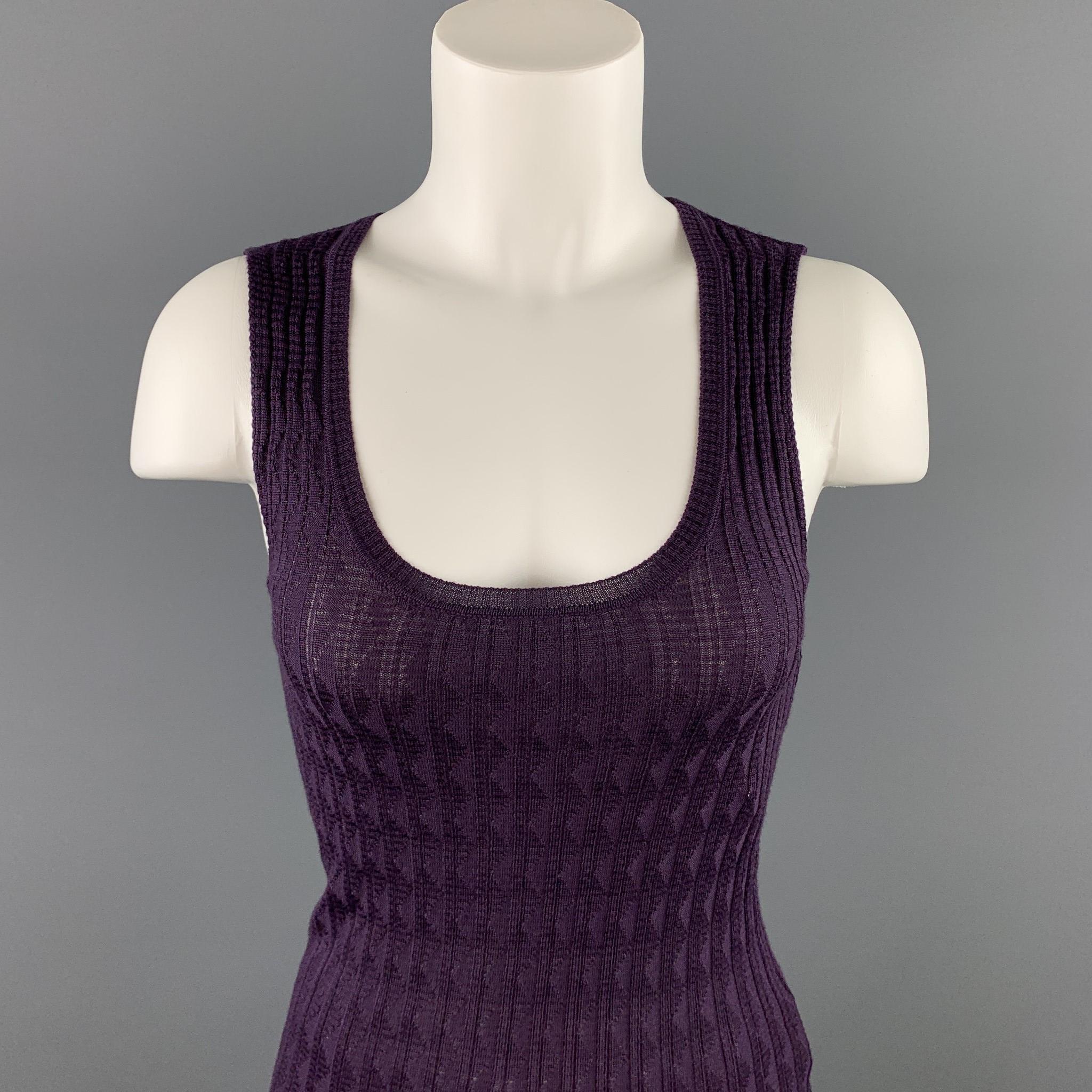 M MISSONI sleeveless top comes in purple knitted textured wool / viscose featuring a scoop neck.

Very Good Pre-Owned Condition.
Marked: I 38, GB 6, USA 2

Measurements:

Shoulder: 12.5 in. 
Bust: 24 in. 
Length: 24 in. 

SKU: 91648
Category: Casual