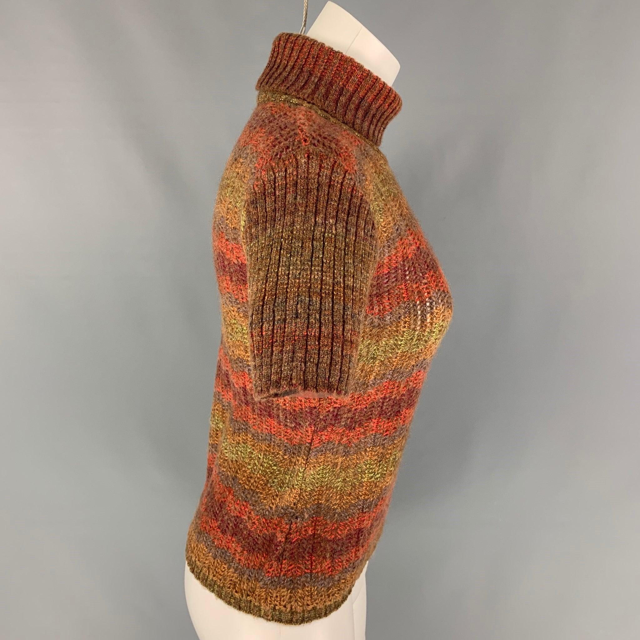 M MISSONI pullover comes in a multi-color knitted wool blend featuring short sleeves and a turtleneck.Very Good
Pre-Owned Condition. 

Marked:   40 

Measurements: 
 
Shoulder: 15 inches  Bust: 32 inches  Sleeve: 8 inches  Length: 20.5 inches 
  
 