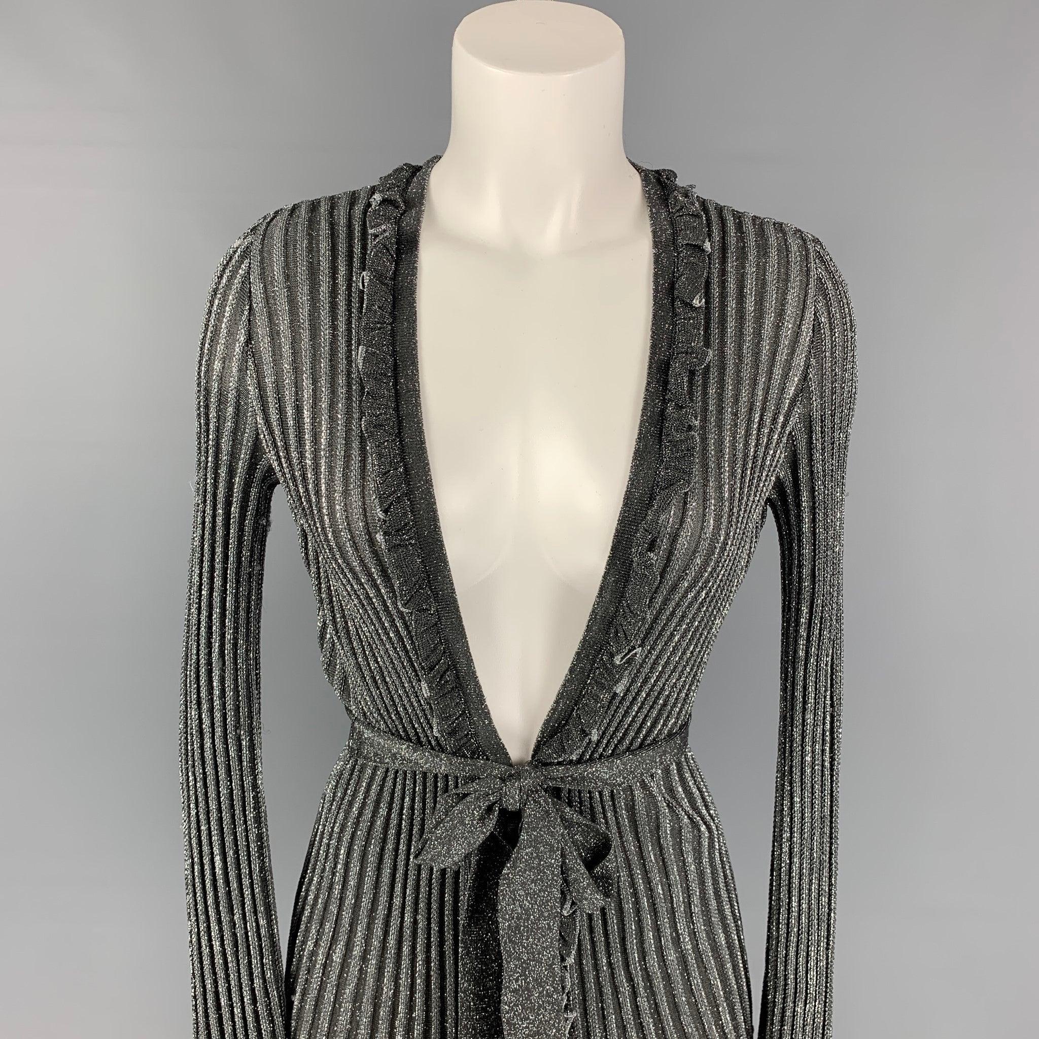 M MISSONI cardigan comes in a silver & black metallic featuring a ruffled trim and a belted style. Made in Italy.
Very Good
Pre-Owned Condition. 

Marked:  
 I 40 / D 34 / A 34 / EFB 36 / GB 8 / USA 4 

Measurements: 
 
Shoulder: 14.5 inches  Bust: