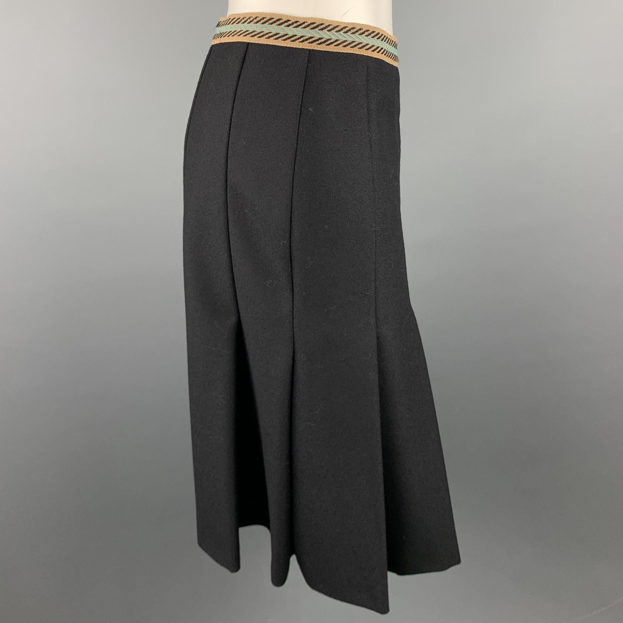 M MISSONI skirt comes in a black twill wool with a black liner featuring a pleated a-line style, ribbon waistband detail, and a side zipper closure. Made in Italy.Excellent
Pre-Owned Condition. 

Marked:   IT 42 

Measurements: 
  Waist: 28 inches