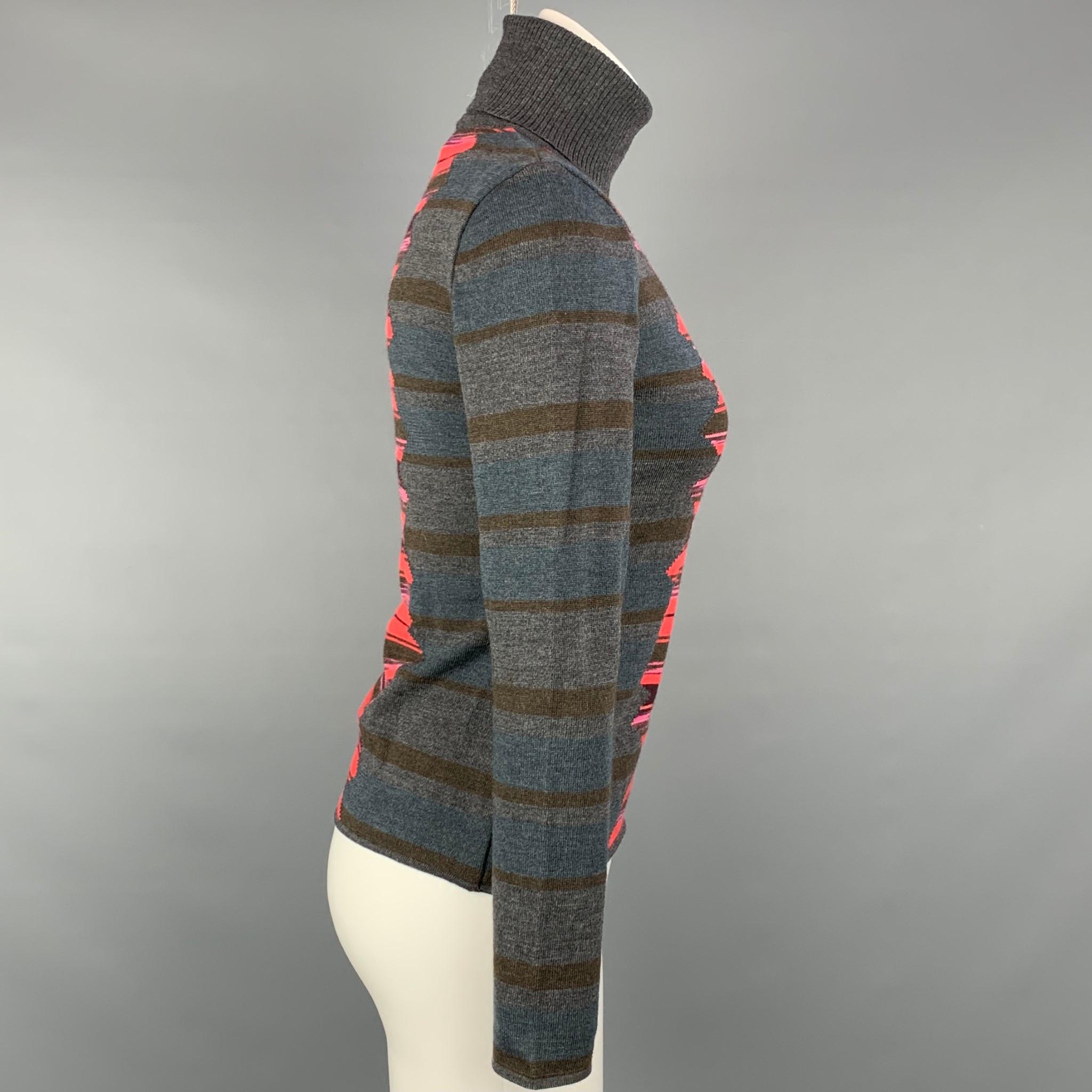 M MISSONI pullover comes in a grey & red merino wool / acrylic color block featuring a turtleneck.

Very Good Pre-Owned Condition.
Marked: 42

Measurements:

Shoulder: 15 in.
Bust: 32 in.
Sleeve: 22.5 in.
Length: 19 in. 
