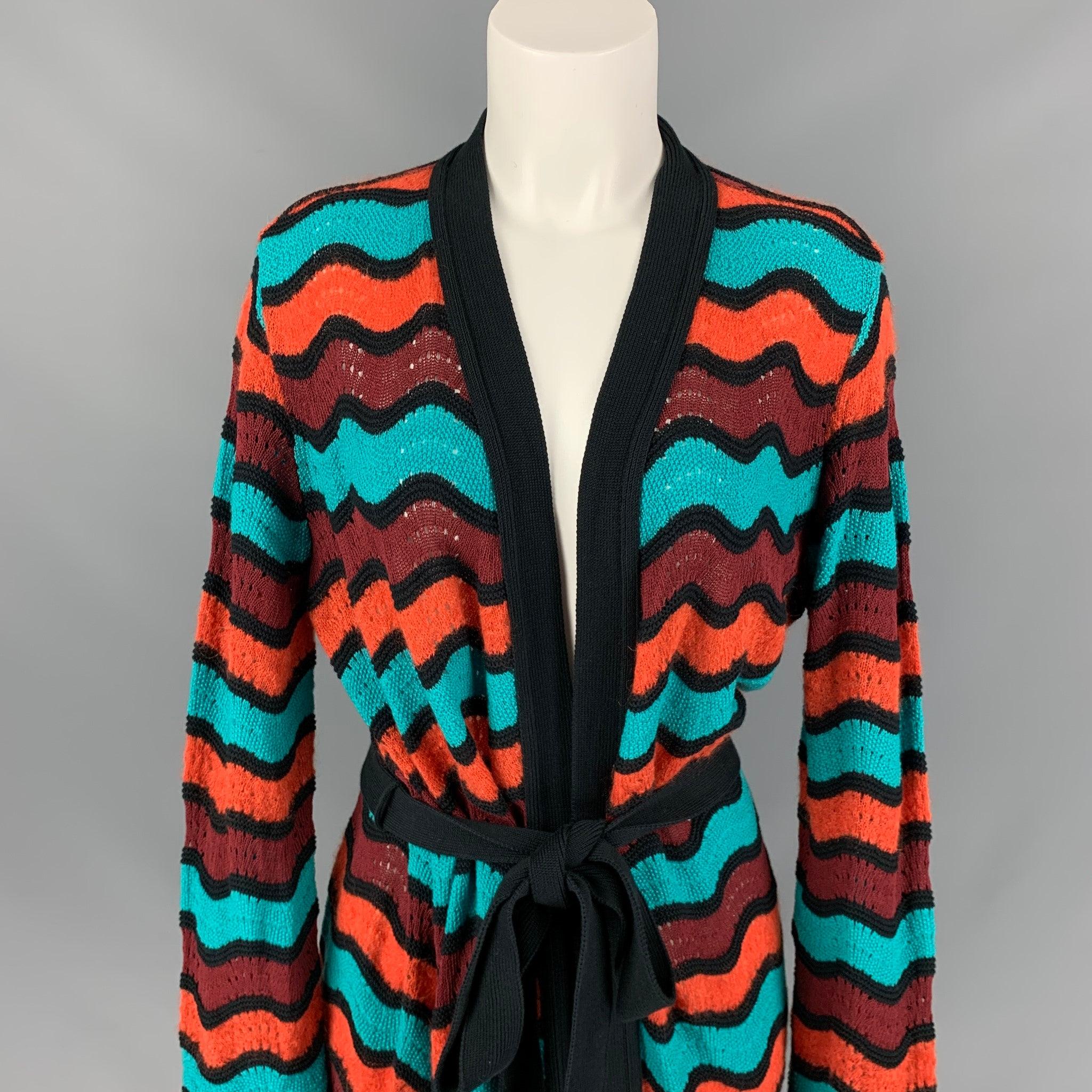 M MISSONI coat comes in a multi-color knitted stripe wool blend featuring a belted style. Made in Italy.
Very Good
Pre-Owned Condition. 

Marked:  46 

Measurements: 
 
Shoulder: 18 inches Bust: 44 inches Sleeve: 27 inches Length: 39 inches 
 
 
