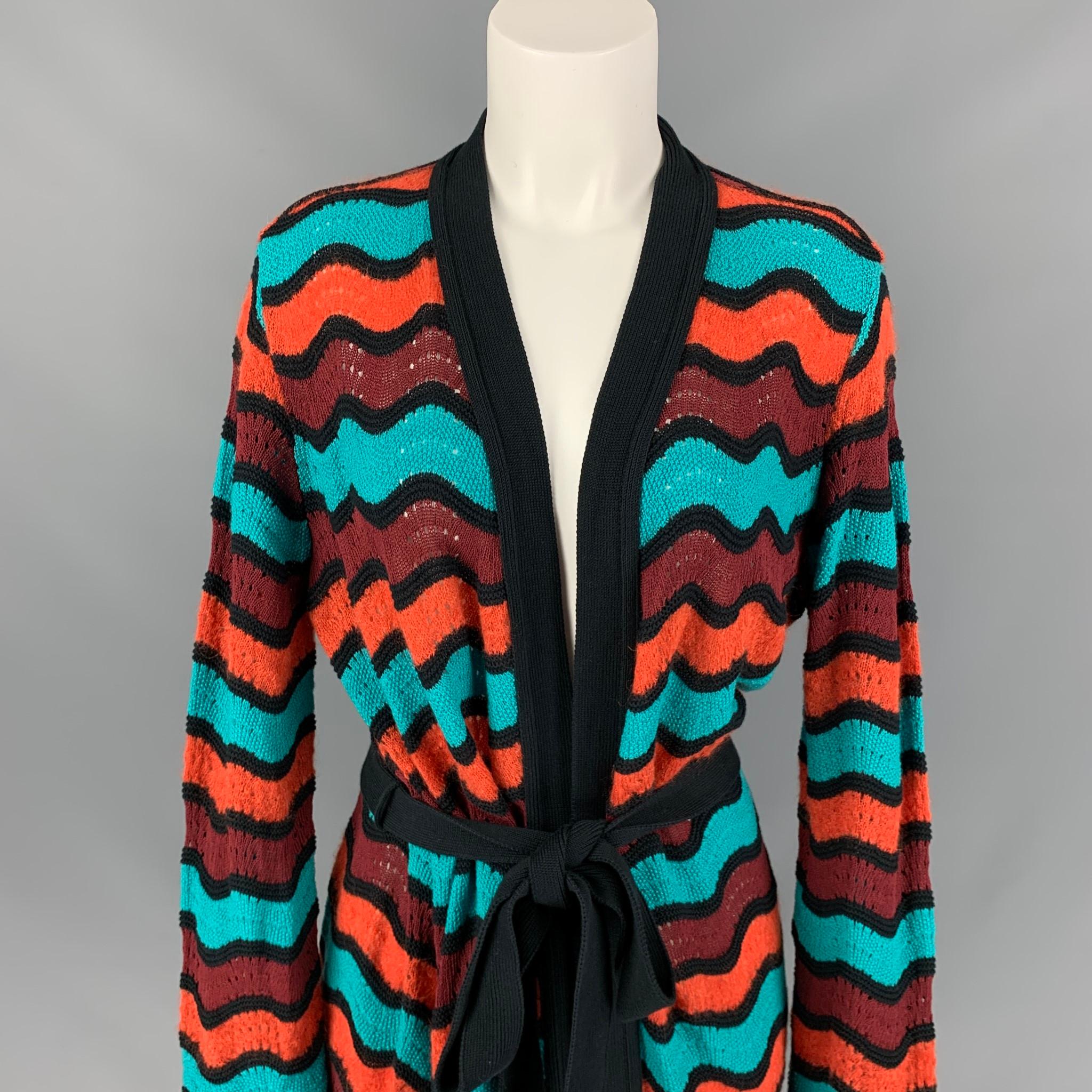 M MISSONI coat comes in a multi-color knitted stripe wool blend featuring a belted style. Made in Italy. 

Very Good Pre-Owned Condition.
Marked: 46

Measurements:

Shoulder: 18 in.
Bust: 44 in.
Sleeve: 27 in.
Length: 39 in. 