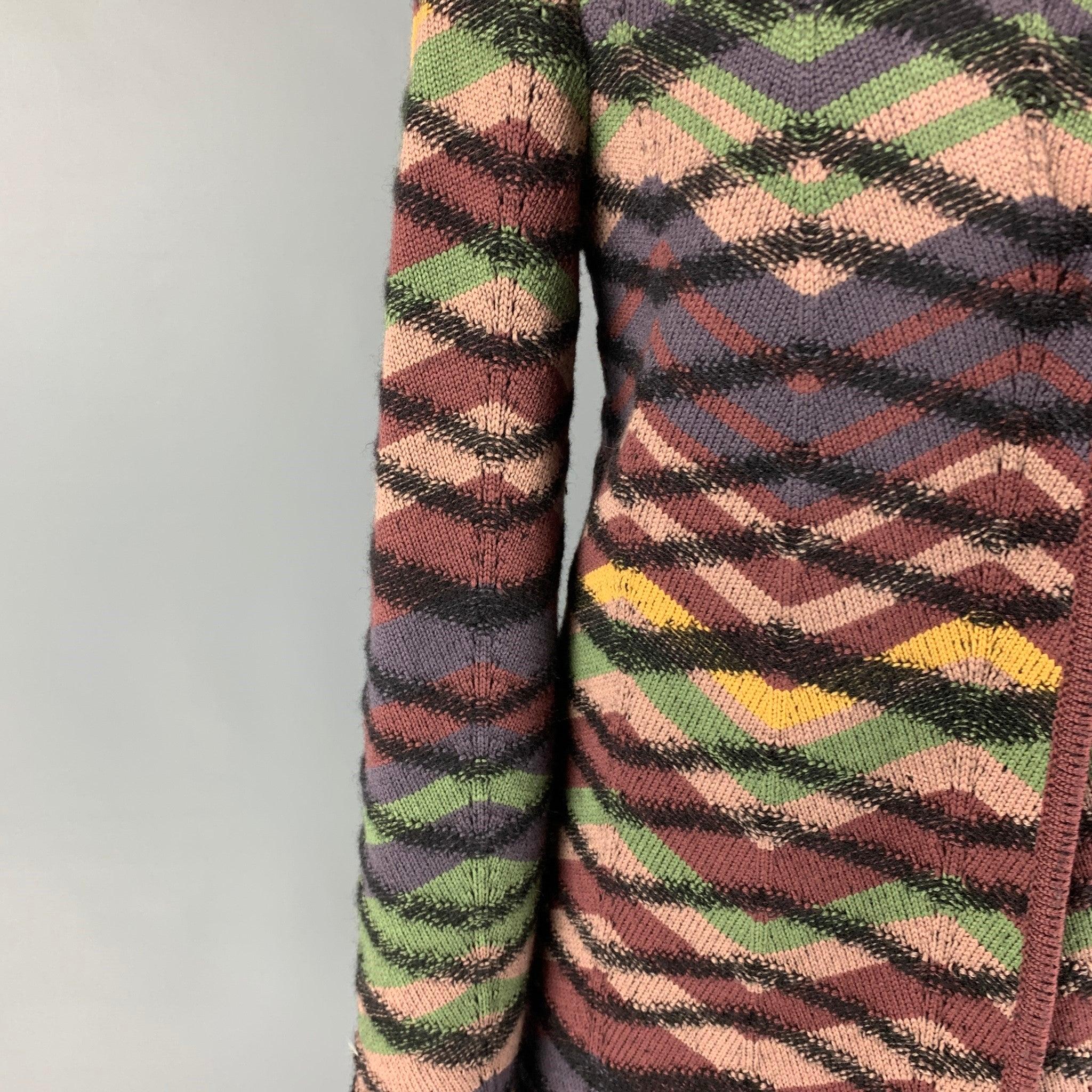 M by MISSONI coat comes in a multi-color knitted wool featuring a collarless style, long sleeves, and a snap button closure. Made in Italy.
Excellent
Pre-Owned Condition. 

Marked:  42 

Measurements: 
 
Shoulder:
16.5 inches Bust: 36 inches Sleeve: