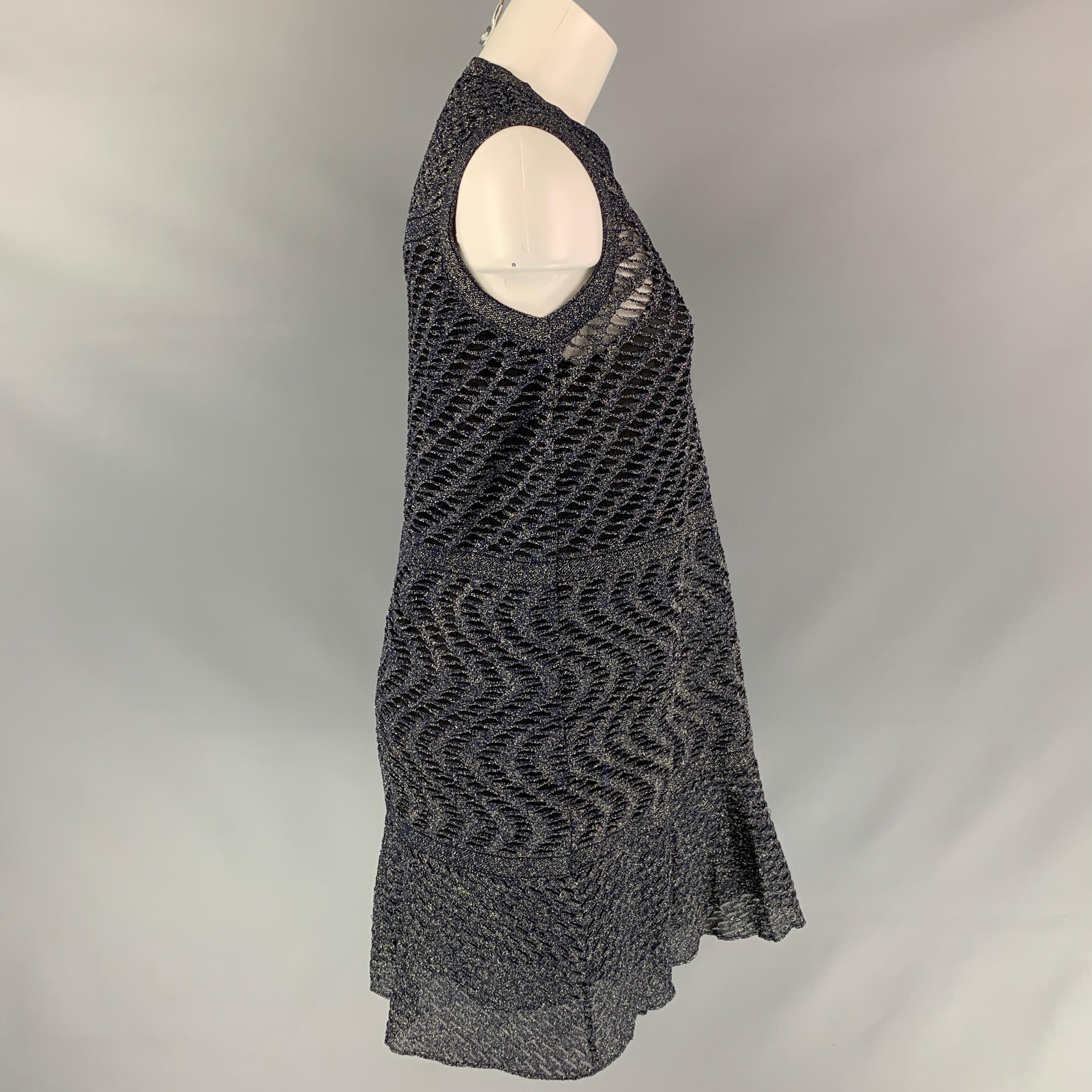 M MISSONI dress comes in a silver & black metallic knitted polyamide blend with a full slip liner featuring a sleeveless style, a-line, and a ruffled hem. Made in Italy. 
 

Very Good Pre-Owned Condition.
Marked: 42

Measurements:

Shoulder: 15