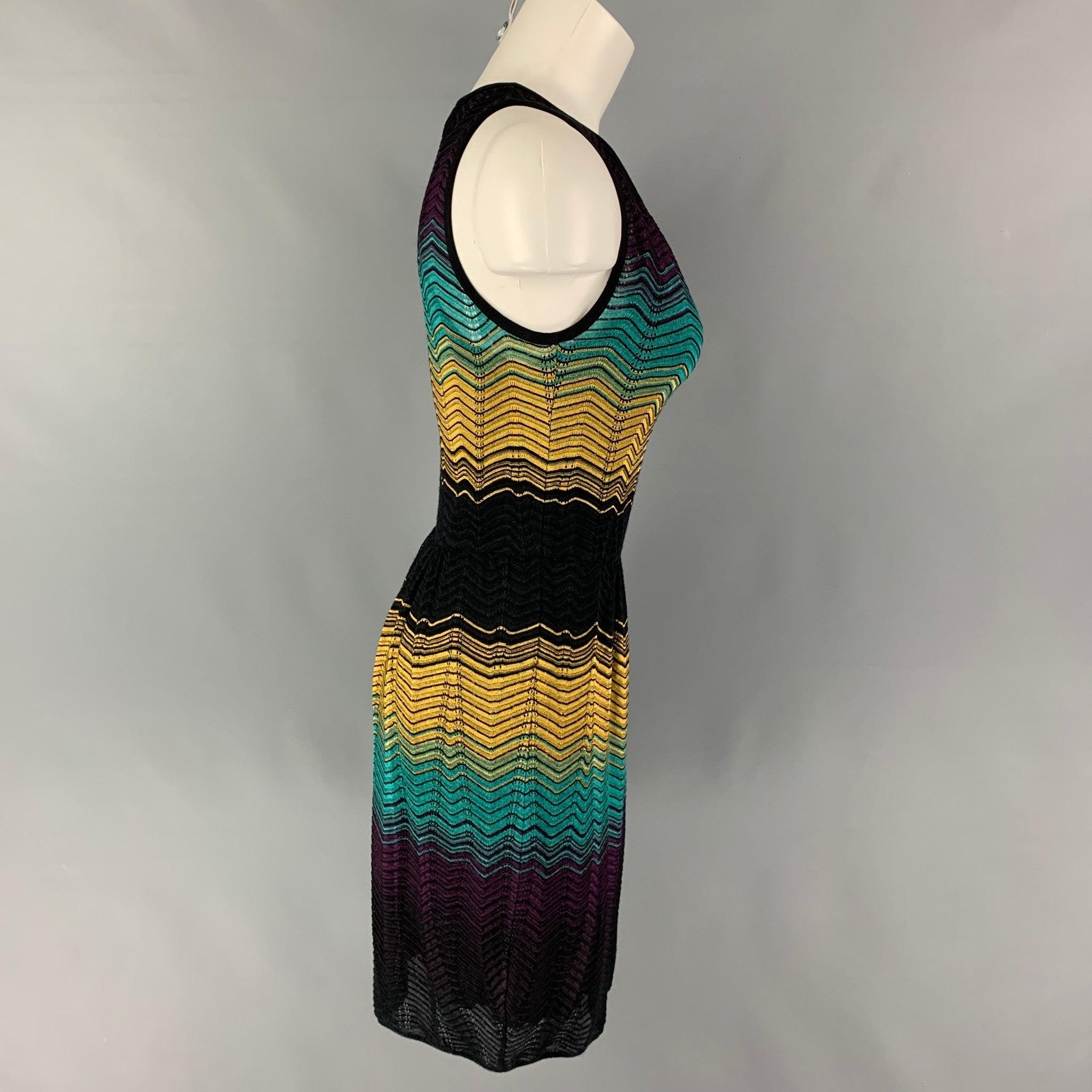M MISSONI dress comes in a multi-color zig zag viscose blend featuring a a-line style, sleeveless, and a elastic waist.
New with tags.
 

Marked:   42 

Measurements: 
 
Shoulder:
9.5 inches  Bust: 28 inches  Waist: 24 inches  Hip: 36 inches 
