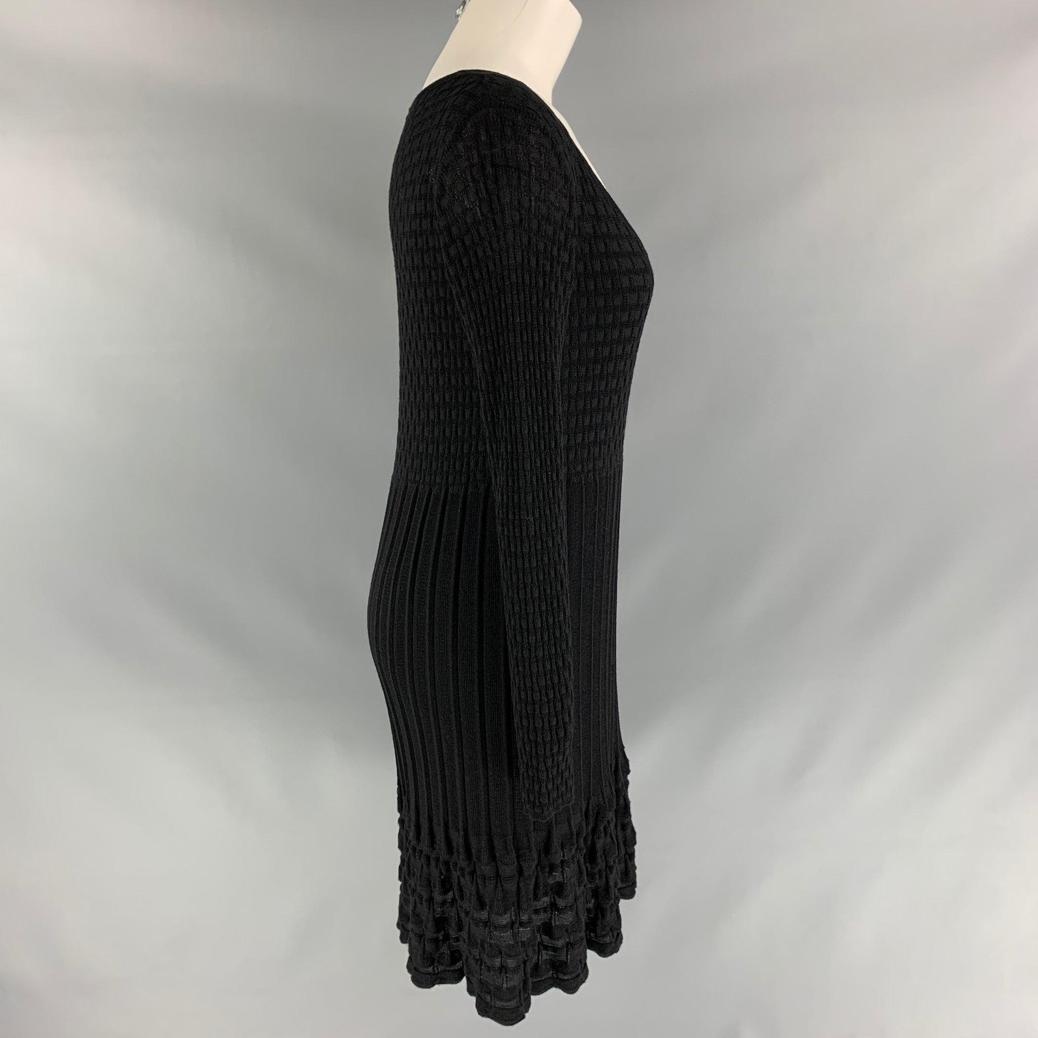 M MISSONI long sleeve A-line dress comes in black knitted wool fabric and removable slip lining. Very Good Pre-Owned Condition. Fabric Tag Removed. 

Marked:   40  

Measurements: 
 
Shoulder: 17 inBust: 33 inWaist: 33 inHip: 36 inSleeve: 26