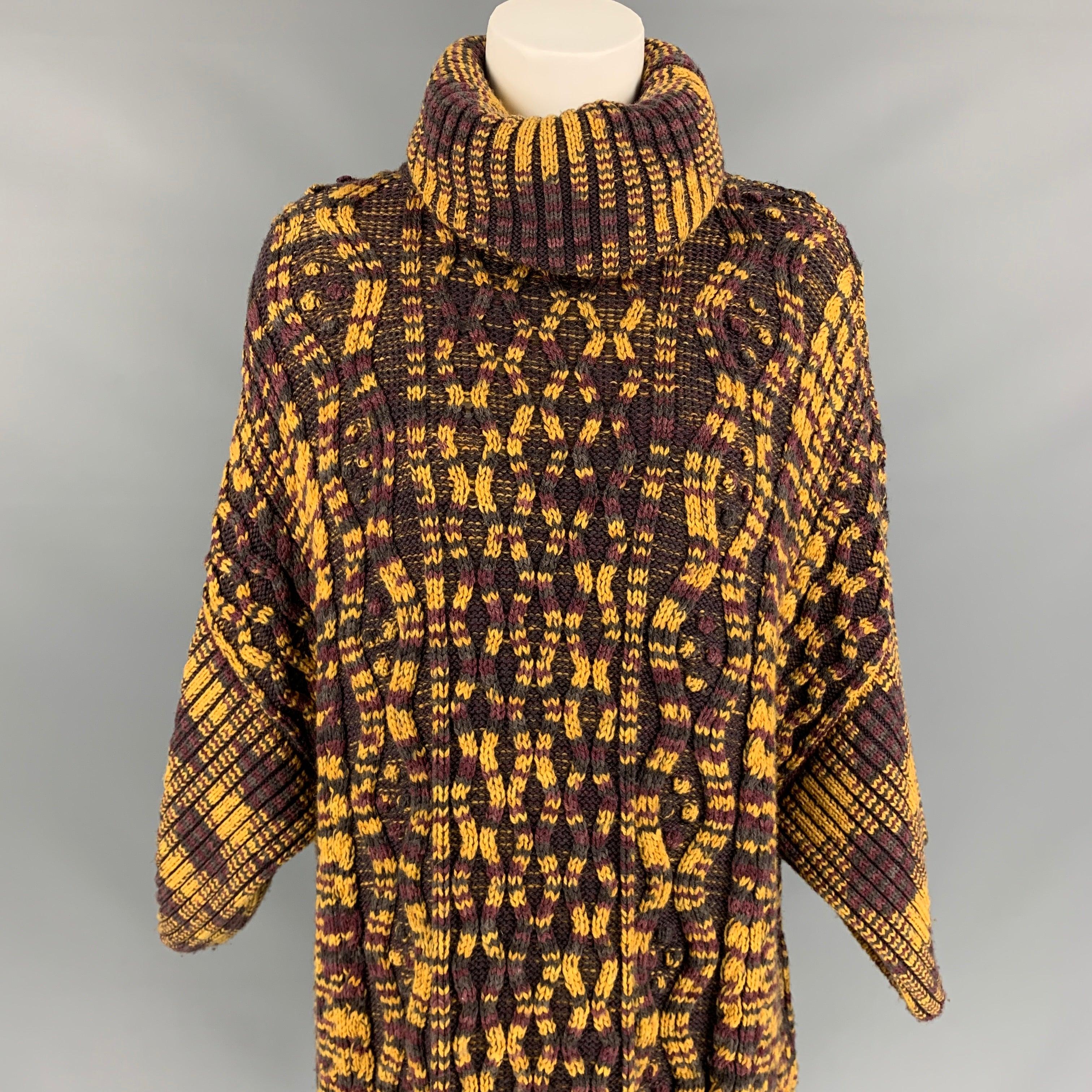 M MISSONI sweater comes in a gold & purple knitted wool blend featuring a oversized fit, 3/4 sleeves, and a turtleneck. Made in Italy. Very Good Pre-Owned Condition. 

Marked:   M 

Measurements: 
 
Shoulder: 27 inches  Bust: 44 inches  Sleeve: 9.5