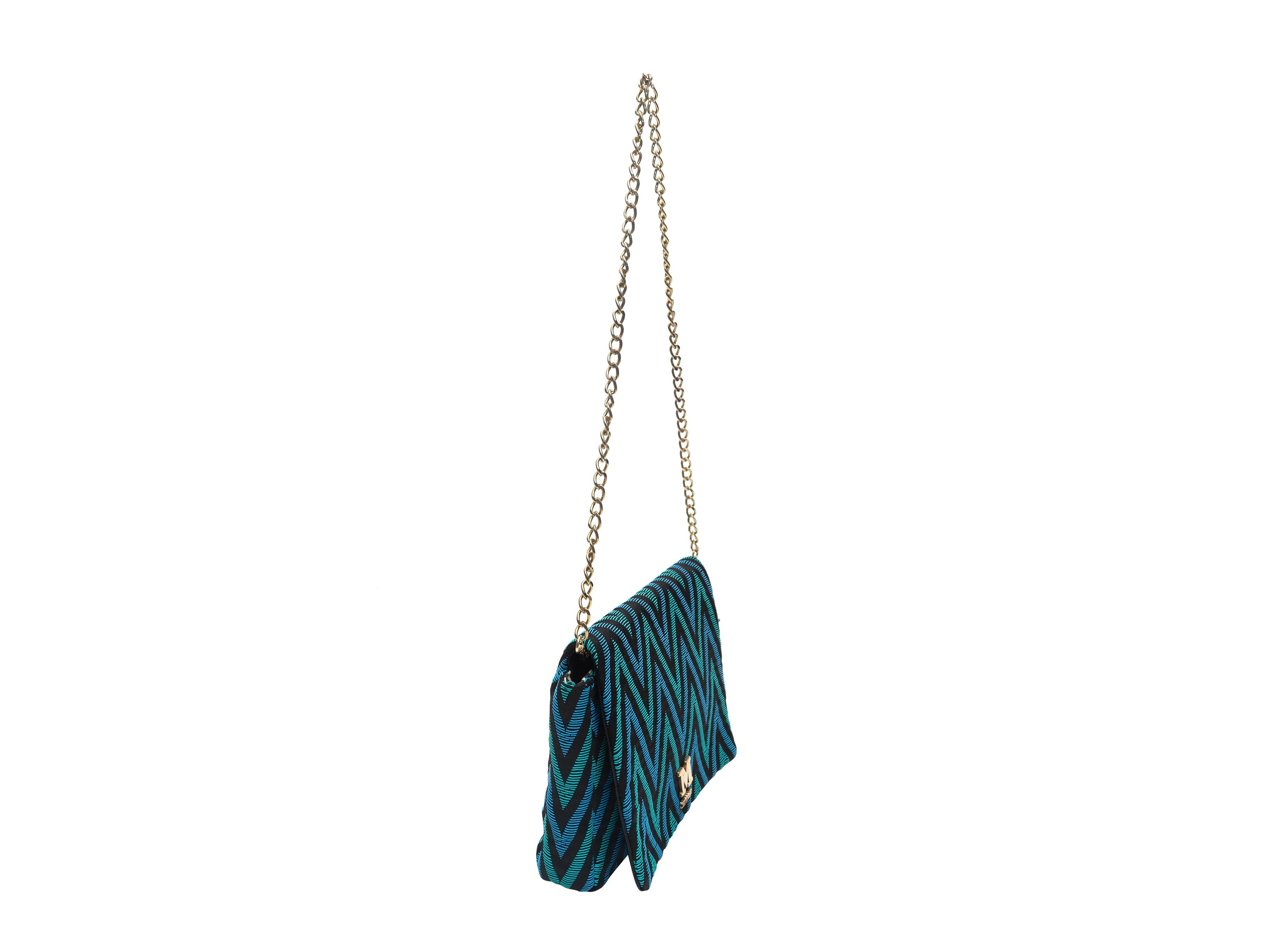 Product details: Teal, blue and black shoulder bag by M Missoni. Chevron pattern throughout. Gold-tone hardware. Chain-link strap. 10