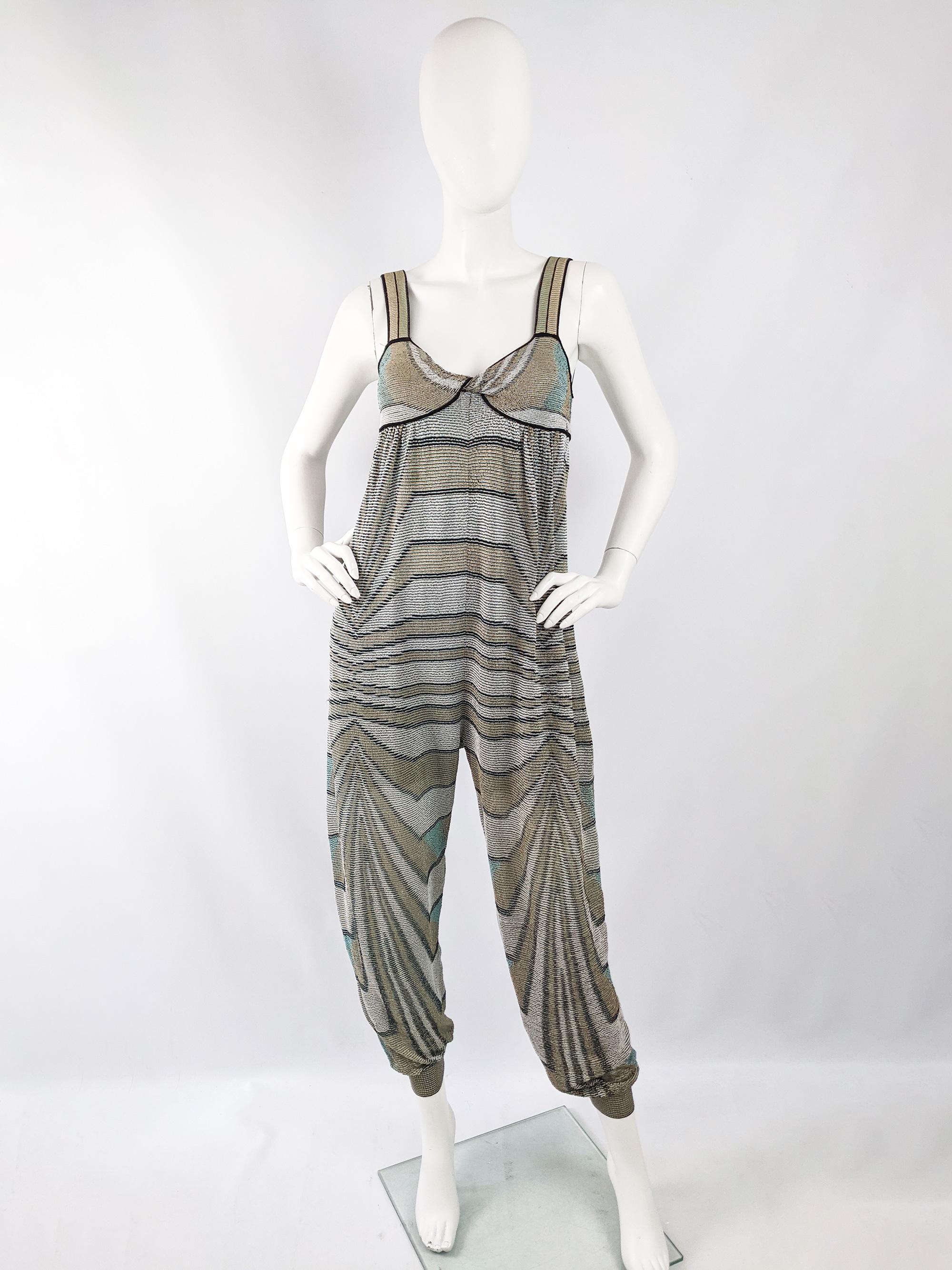 A fabulous M Missoni womens jumpsuit in a cotton and viscose mix lurex knit fabric with a sleeveless design and a loose, harem style fit which would look great worn with a belt at a party or kept unbelted for a more casual, relaxed look by the