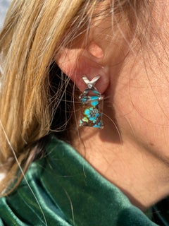 m Pair of 18k white gold diamond and turquoise matrix set earring: