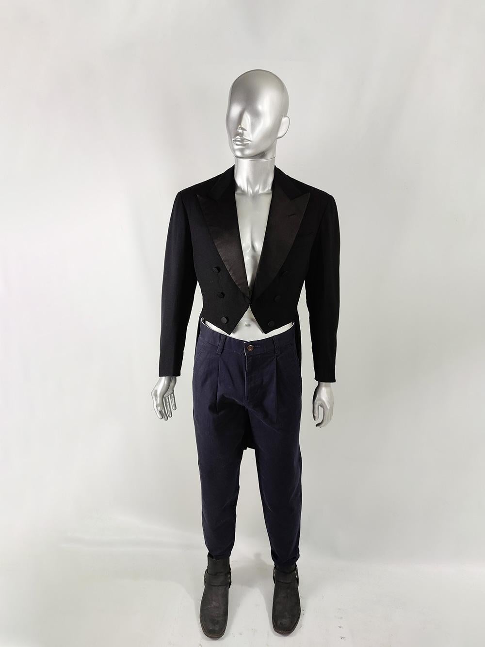 An incredible quality vintage mens traditional tailcoat from c. the 1950s by luxury Italian tailor, M. Rotunna of Rome. In a black wool with satin peak lapels, perfect for a formal, white tie event or just worn in a gothic / Victorian inspired