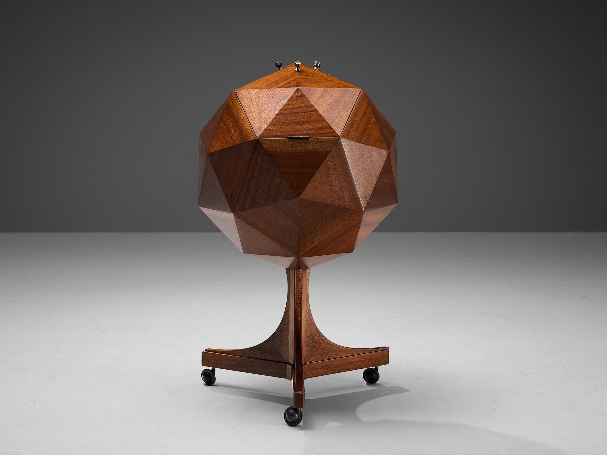 M. Vuillermoz, dry bar cabinet, mahogany, brass, steel, wood, France, 1960s 

This characteristic bar cabinet was designed by M. Vuillermoz and finds itself at the intersection of art and design. The construction of the bar is based on a polygonal