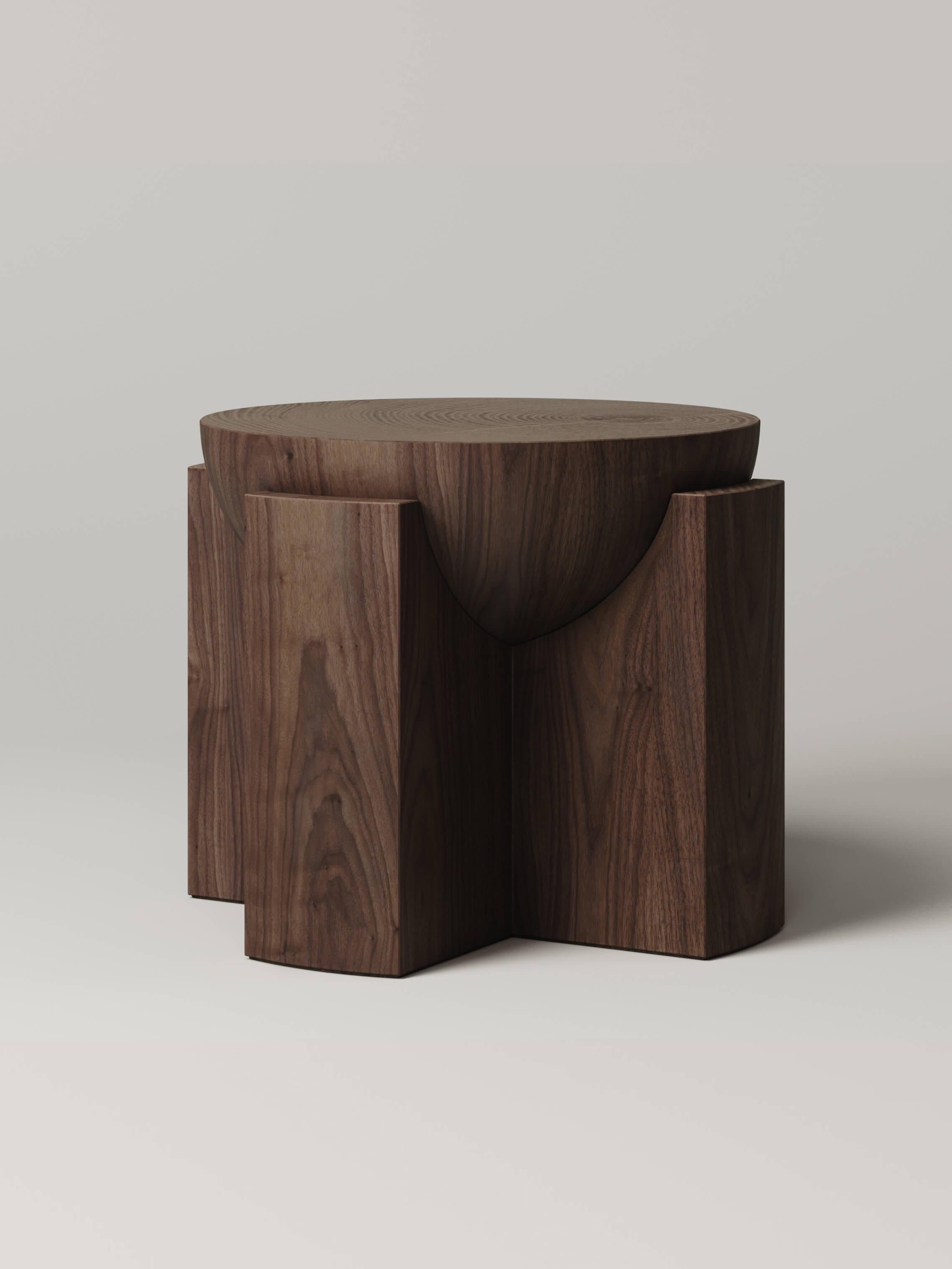Composed of two pieces of carved walnut, the half-dome sphere of the M_003 side table floats effortlessly within its base. The sculptural and heavily proportioned form is simultaneously a functional object and a piece of art.

Designed in
