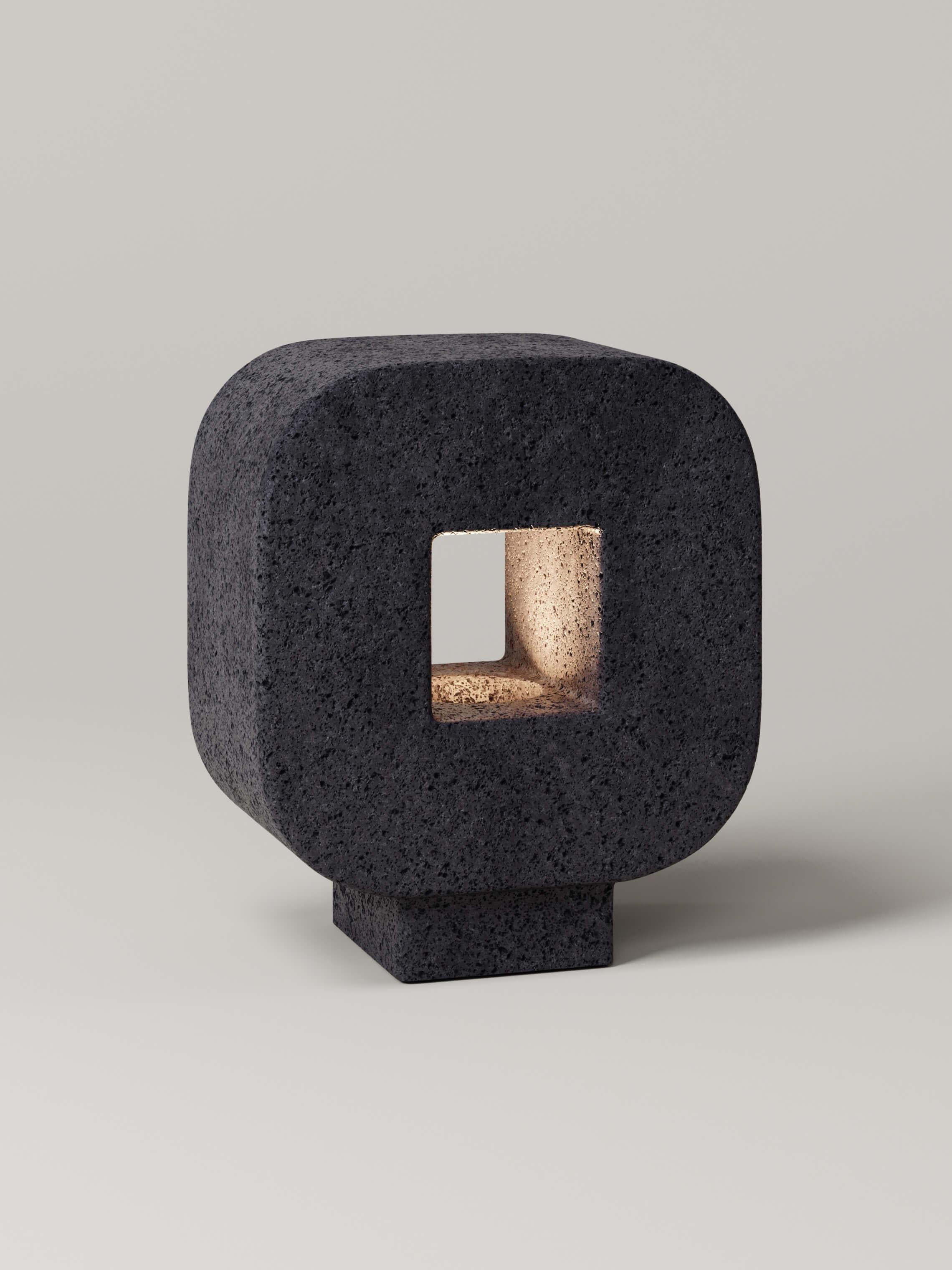 M_004 Lava Rock Table Lamp by Monolith Studio
Signed and Numbered.
Dimensions: D 20 x W 37 x H 42 cm.
Materials: Lava rock.

Available in travertine, onyx and lava rock. All our lamps can be wired according to each country. If sold to the USA it