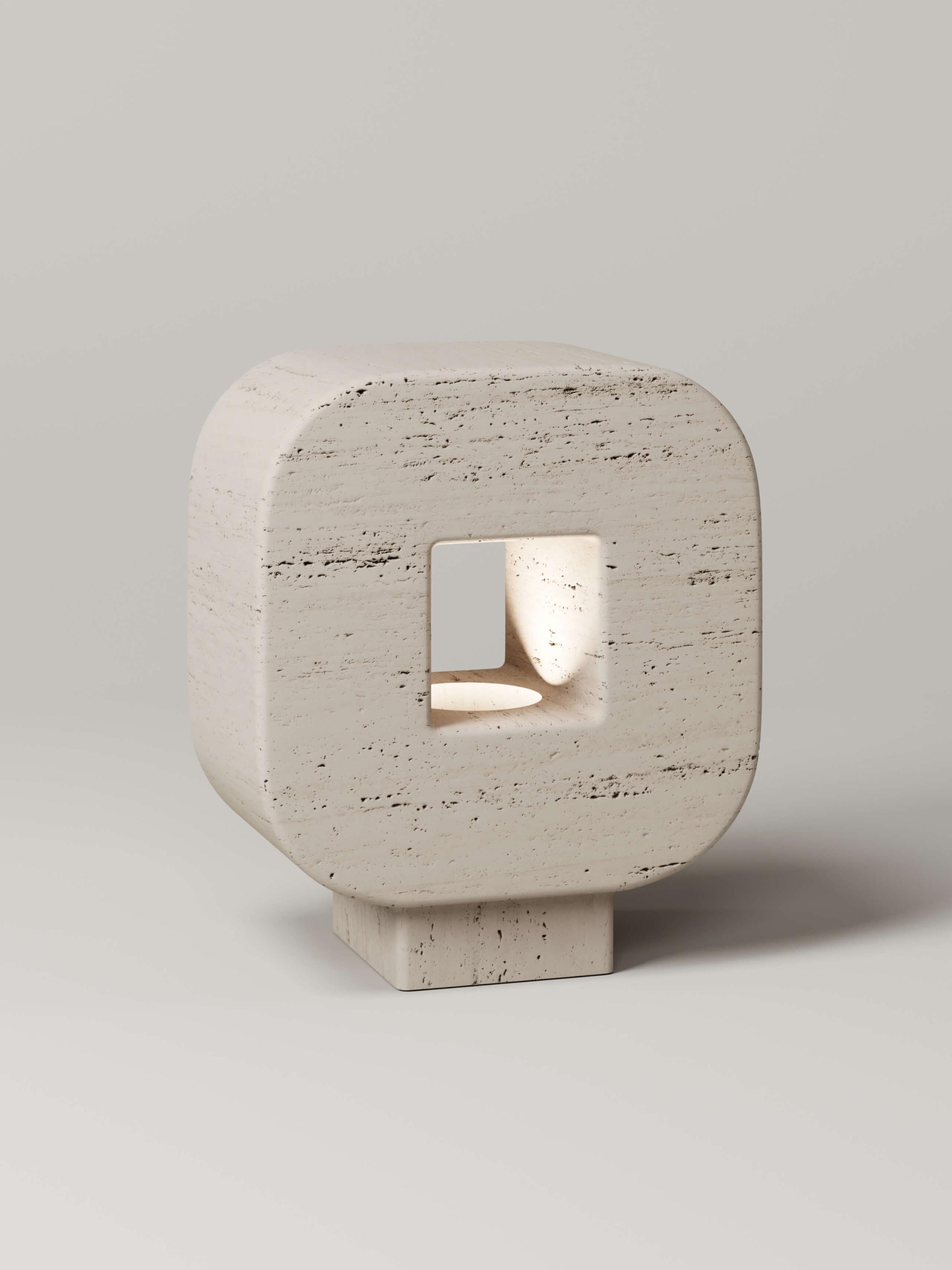 Cut from a single stone, the prehistoric form of the M_004 Lamp blurs the line between tool and object. Its warm glow shines softly through its commanding form powered by a dimmable 2,700K led hidden elegantly within its base.

Numbered and