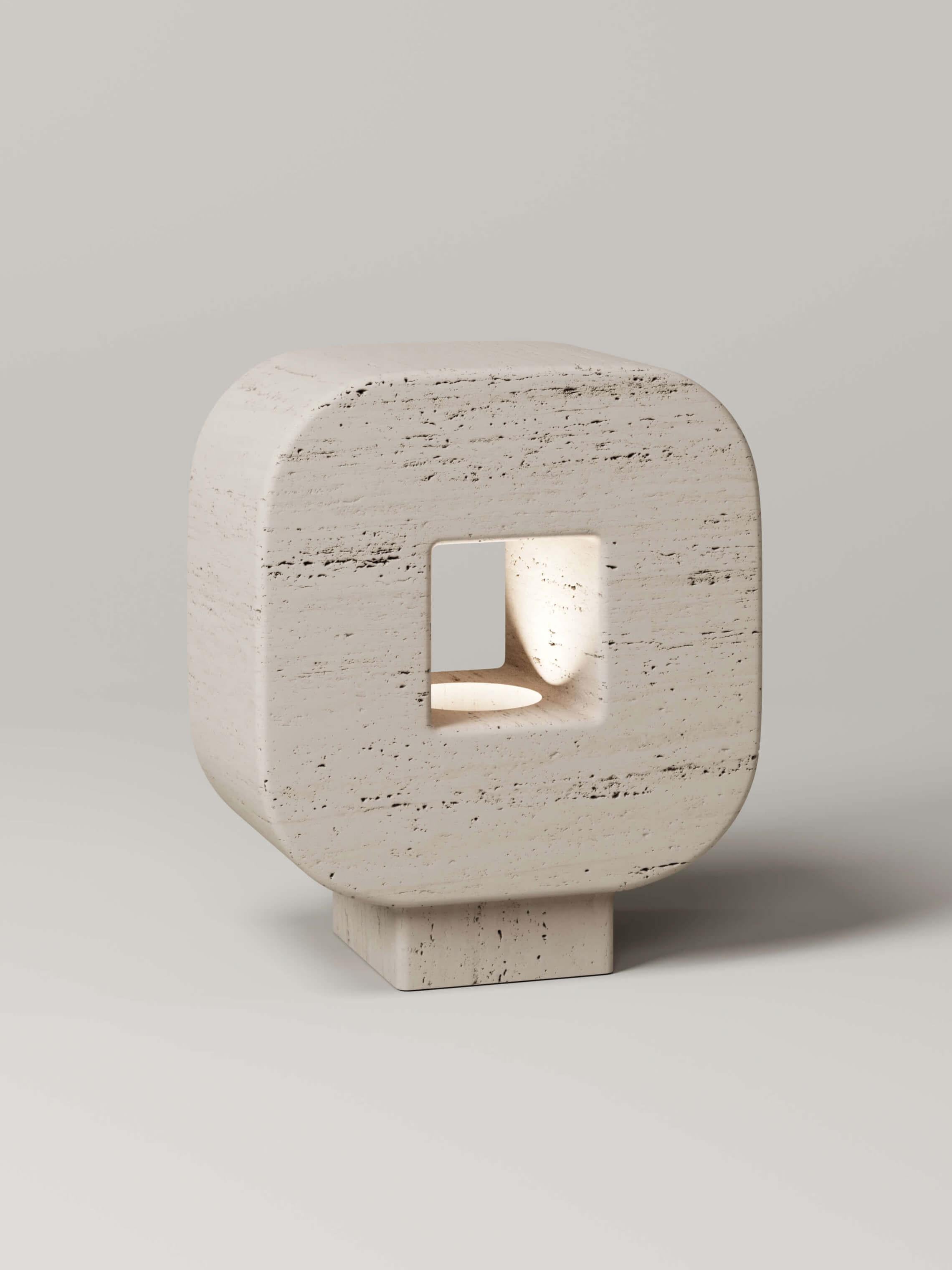 M_004 Travertine Table Lamp by Monolith Studio
Signed and Numbered.
Dimensions: D 20 x W 37 x H 42 cm.
Materials: Travertine. 

Available in travertine, onyx and lava rock. All our lamps can be wired according to each country. If sold to the USA it