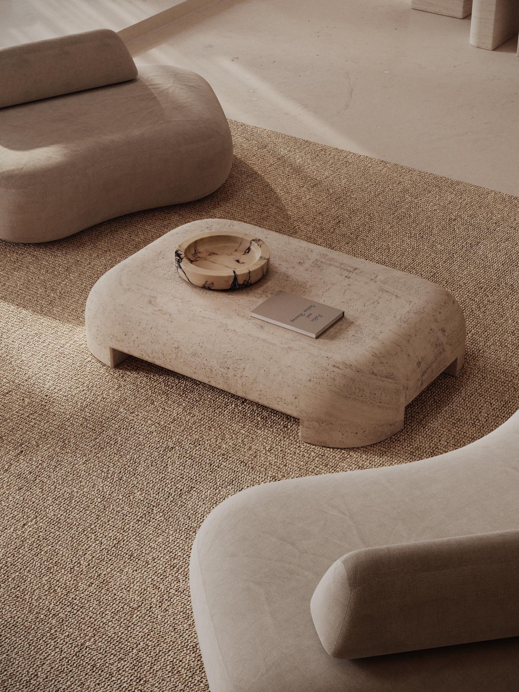 The M_012 Coffee Table is masterfully carved from a single slab of travertine. It's brutalist design is both sculptural and powerful. It is suitable for both indoor and outdoor use.  

The table is hollowed from underneath for weight reduction.