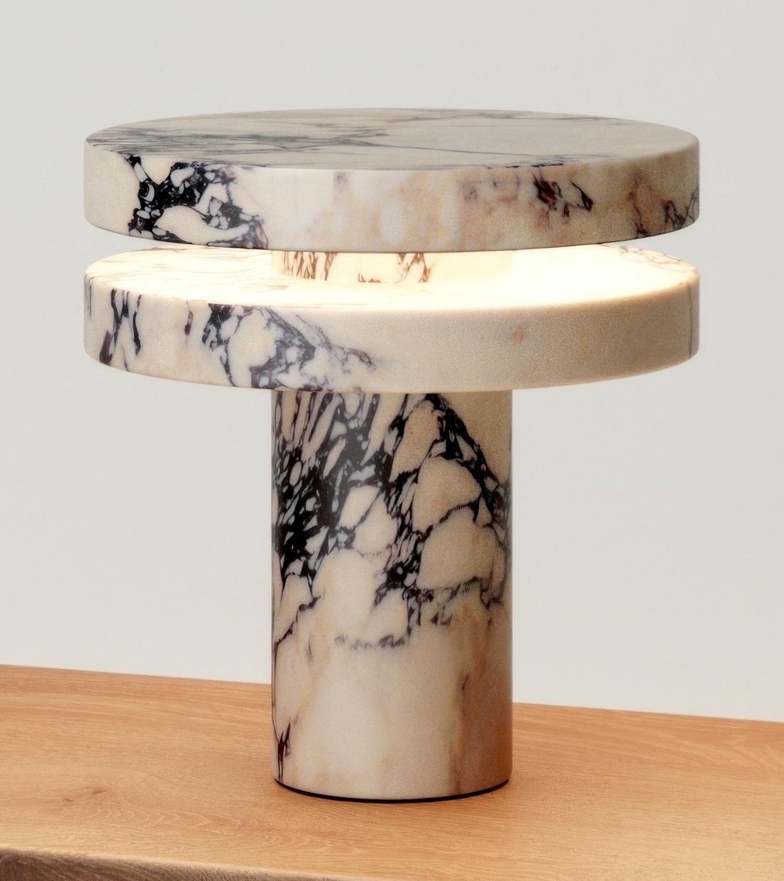 M_014 Table Lamp by Monolith Studio
Signed and Numbered.
Dimensions: Ø 30 x H 32 cm.
Materials: Calacatta Viola marble.

Available in travertine, onyx and lava rock on request All our lamps can be wired according to each country. If sold to the USA