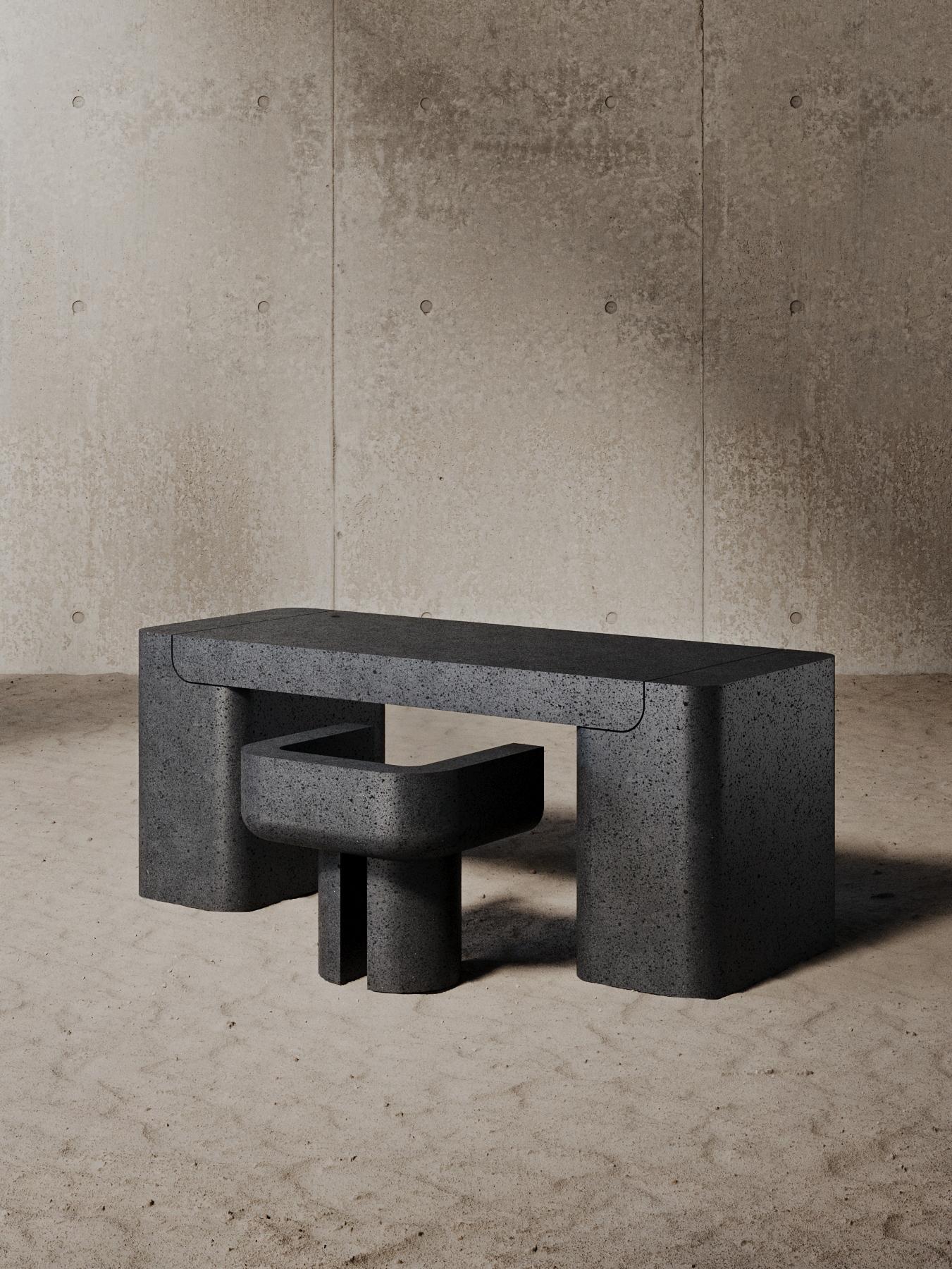 Carved from a single block of lava stone, the M_016 Desk's minimalist form and powerful silhouette bring a bold, brutalist style to any room.

Numbered and Signed

 *Given the unique nature of stone, each piece will vary in look. 
Available in