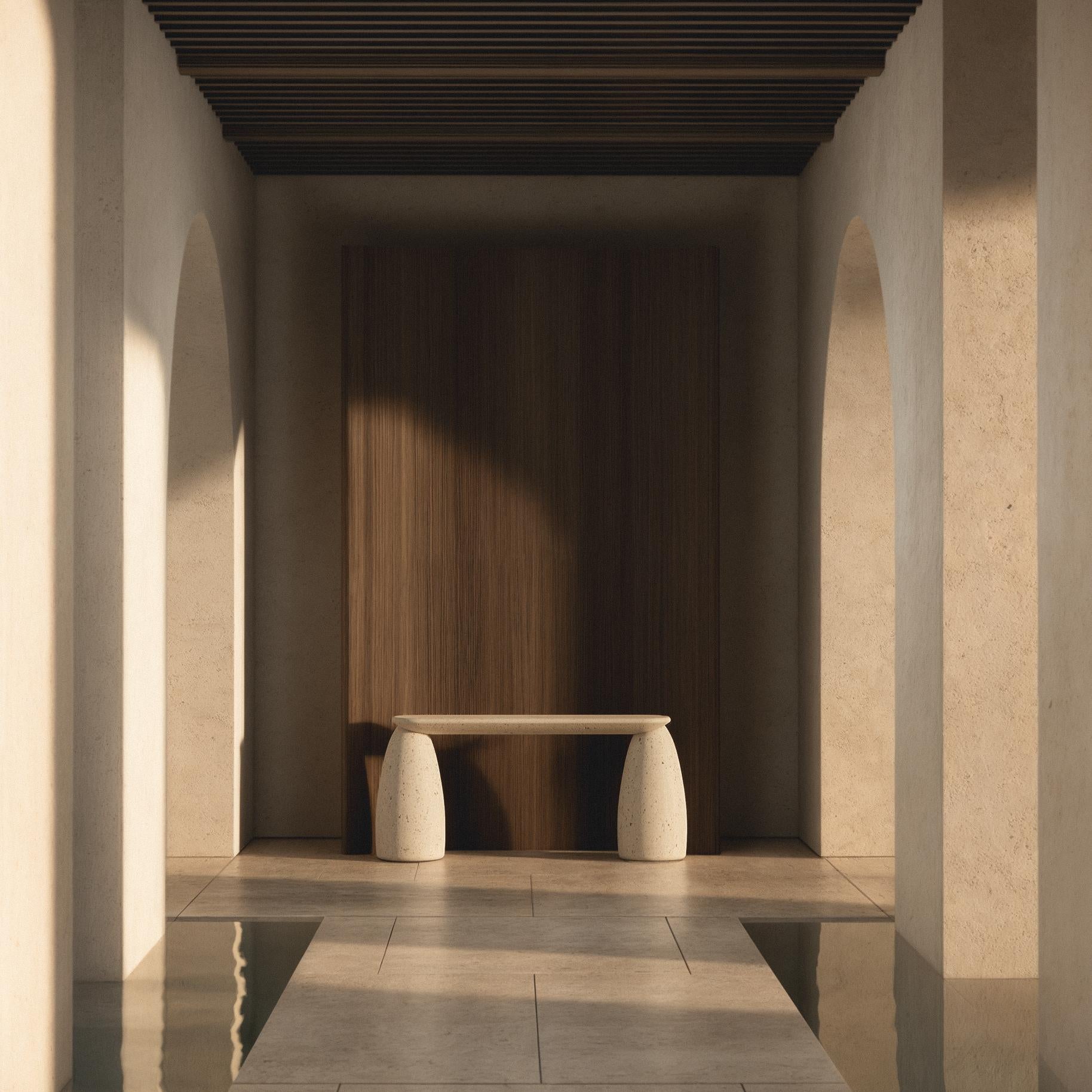 The M_017 Tuye Console embodies a delicate balance between monolithic solidity and lightness. With its earthy travertine outline, it seamlessly integrates into diverse design contexts serving as a versatile stage for curated objets d'art.

Designed