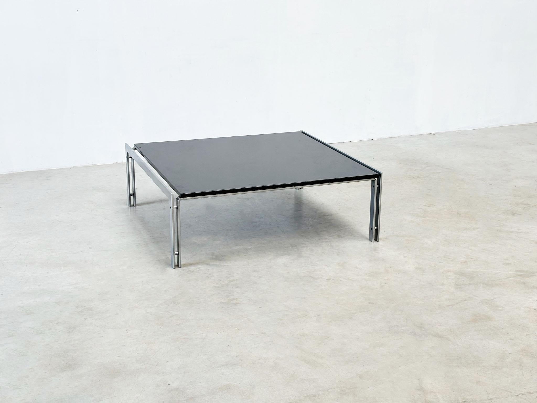 M1 granite and steel coffee table by Hank Kwint for Metaform
This steel M1 coffee table, designed by Hank Kwint and manufactured by the Dutch company Metaform in the 1970s, showcases a sleek dark granite top and a sturdy steel frame. The table is in