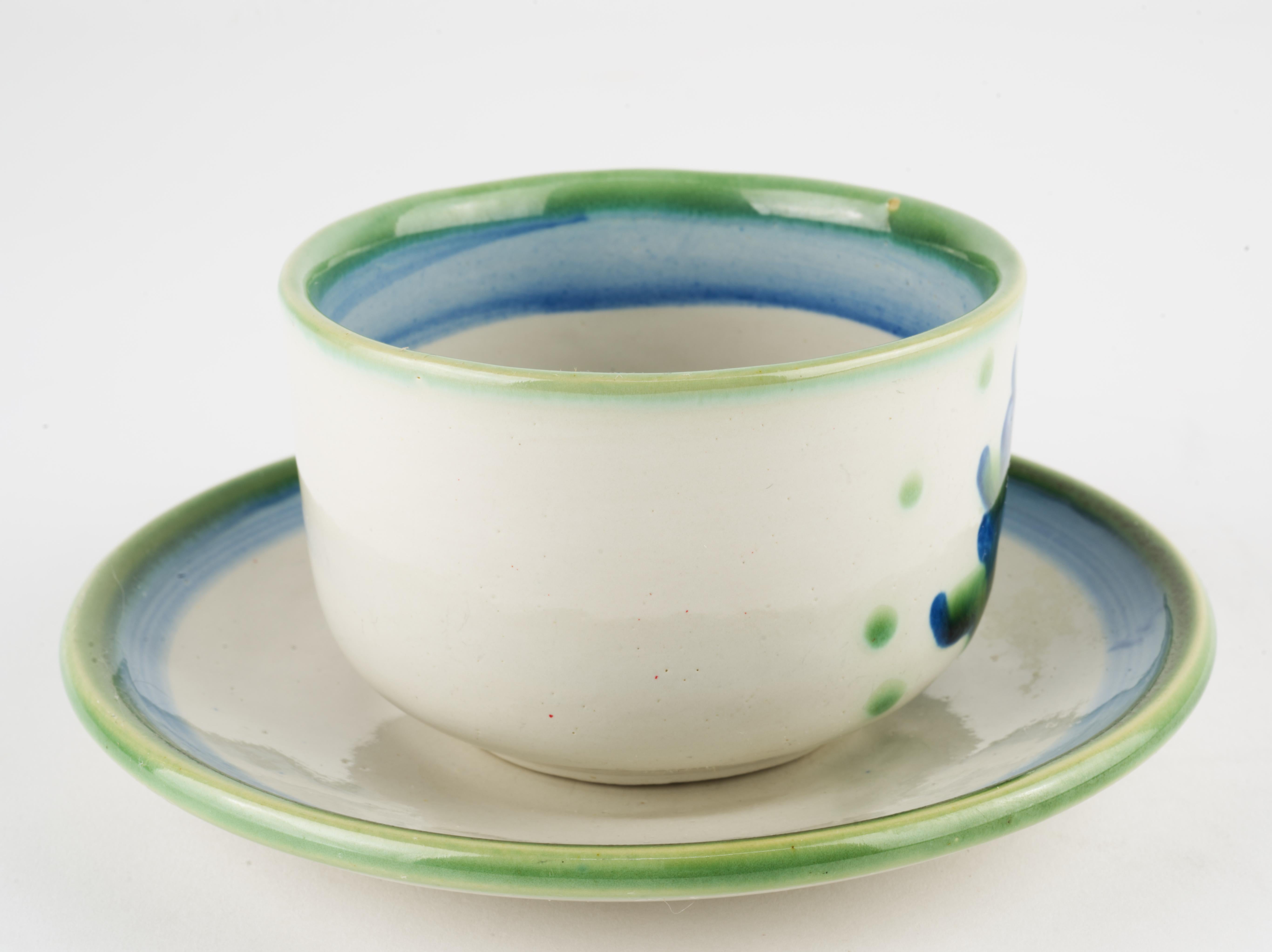 Glazed M.A. Hadley Pottery Cup and Saucer, Bouquet Blue and White For Sale