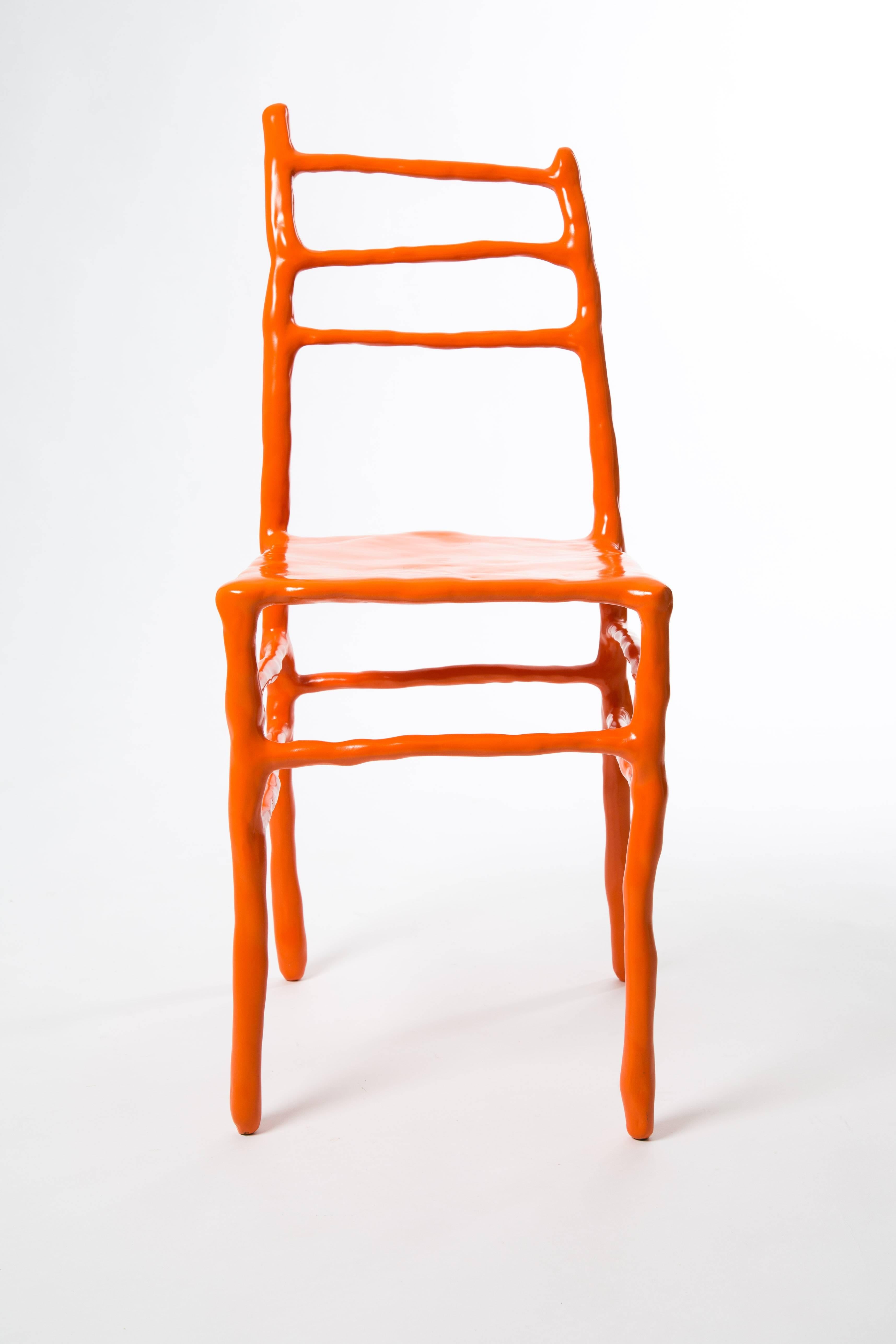 Maarten Baas made this clay chair at the art fair Art Basel in 2007. This chair is one of five orange clay chairs numbered 2/5. He is now one of the most famous Dutch designers. Signed by Maarten Baas with marker. Naam BAAS in metal and year as a