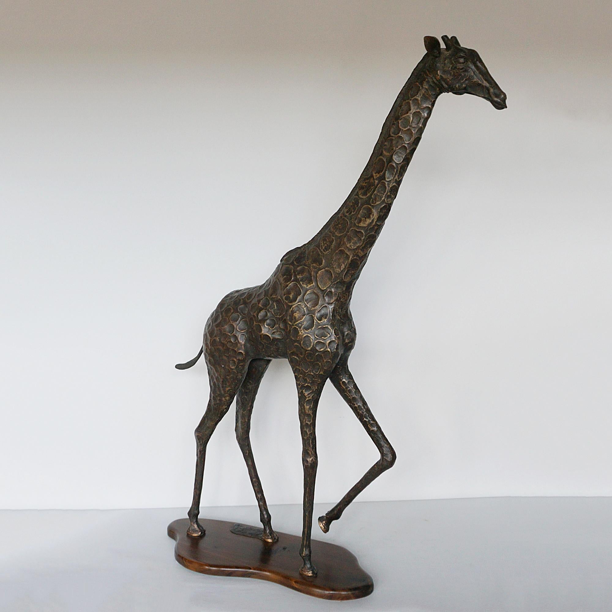 'Maasai Giraffe' A large early 21st Century patinated bronze sculpture of a giraffe by Denis Mathews. Signed and dated 'Denis Mathews 2009'. Copy 6/25.

Dimensions: H 102cm W 72cm D 20cm

Origin: Kenyan

Date: Early 21st Century 

Item Number 0910245