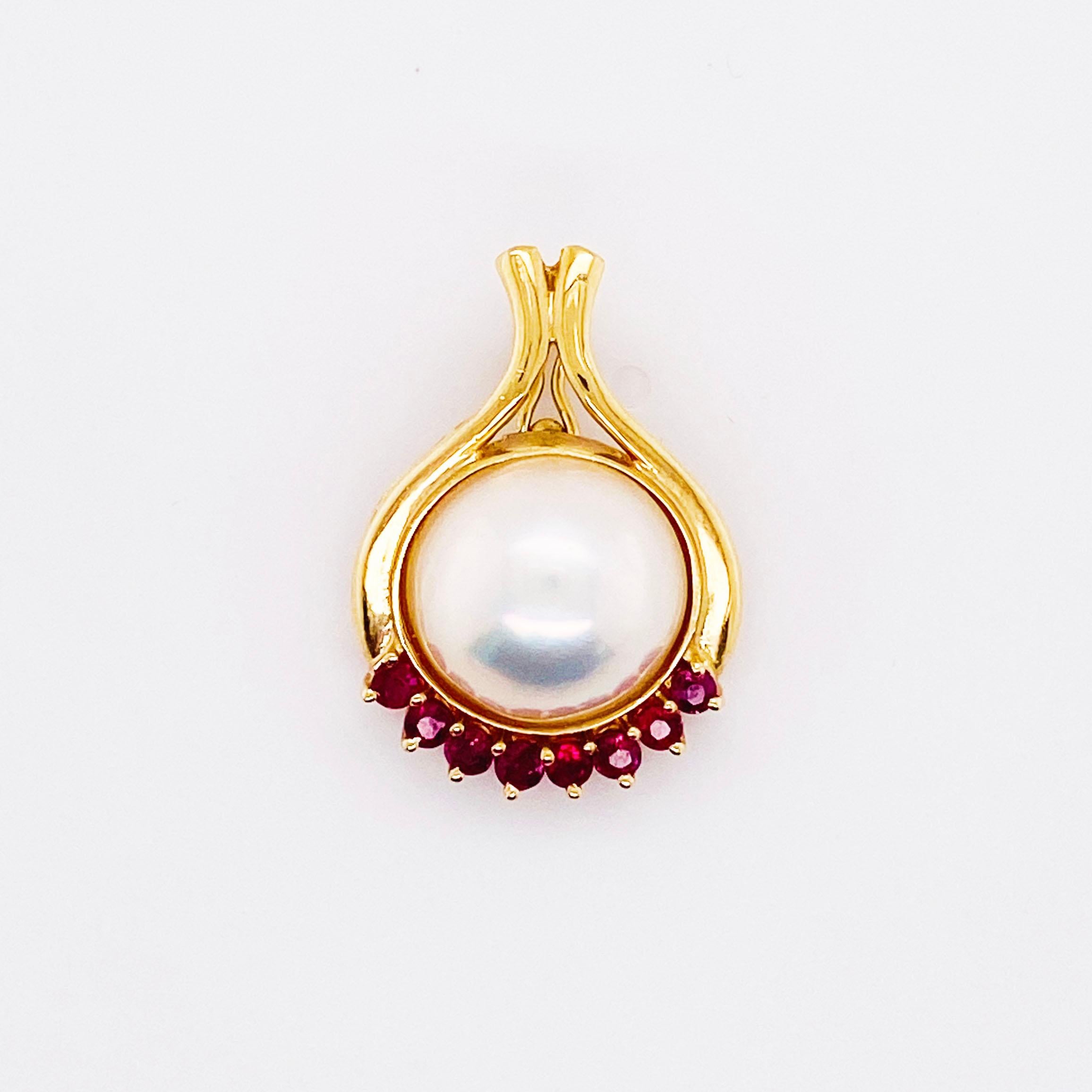 Pearls and rubies are a beautiful combination and this pendant enhancer has this very design!  The mabe pearl is twelve (12) millimeters with gorgeous luster, orient, and a beautiful rose/white color.  There are seven-.07 to .075 carat round, red