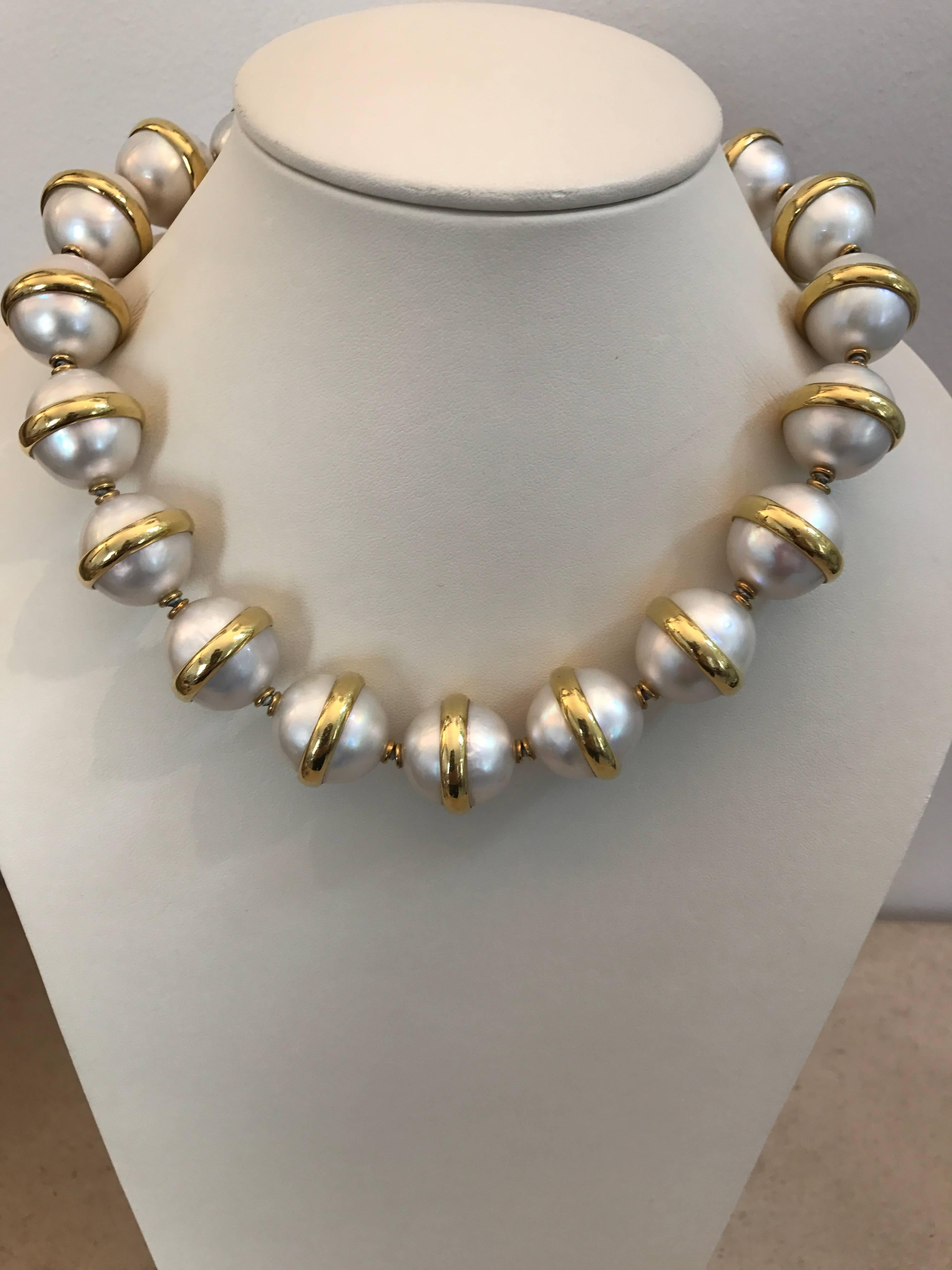 A magnificent 18ct yellow gold and mabe pearl Planet necklace signed by Paloma Picasso for Tiffany & Co. 1981.  Designed as twenty sections of two 18mm mabe pearls joined by 18ct gold rings

Overall length of necklace 44.5cms approximately