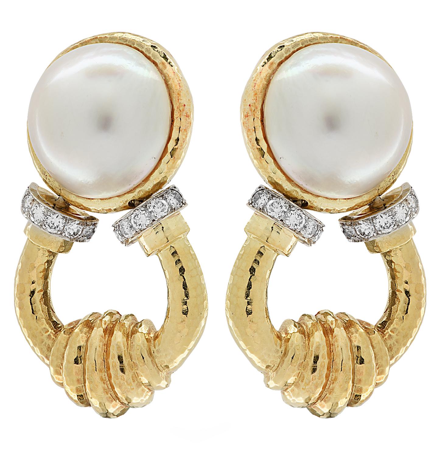 Striking door knocker clip on earrings crafted in 18 karat yellow and white gold, showcasing two mabe’ pearls measuring 20 mm in diameter, accented by 24 round brilliant cut diamonds weighing approximately 1.2 carats total, H-I color, VS-SI clarity,